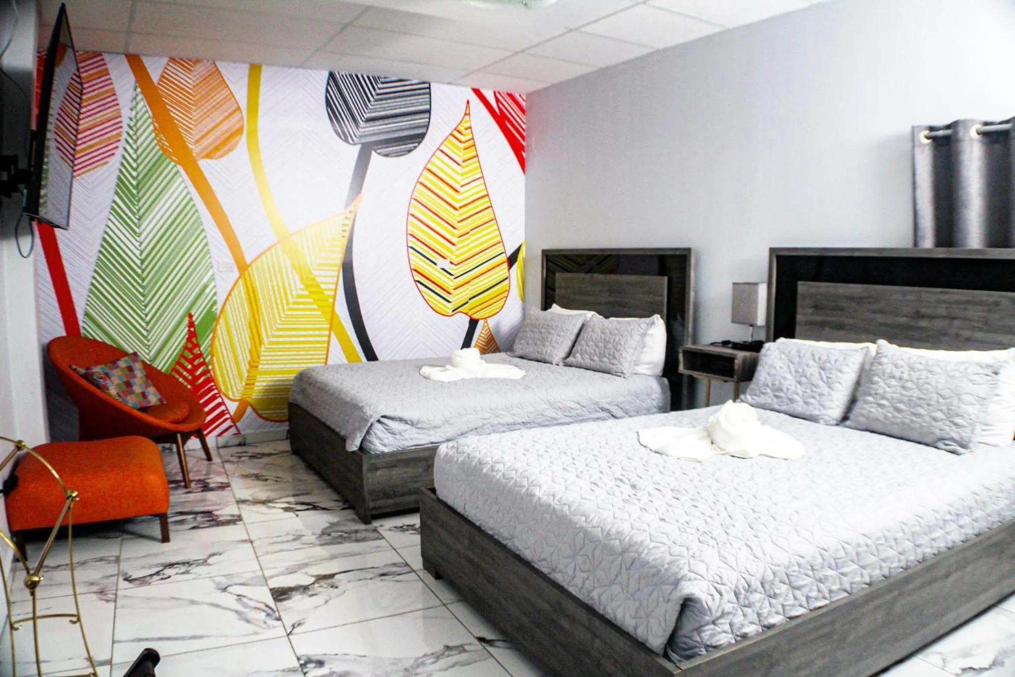 Bed in Itza-Bella Suites