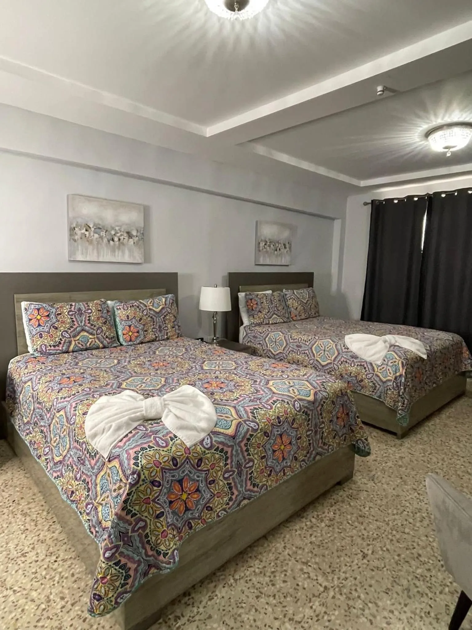Bed in Itza-Bella Suites
