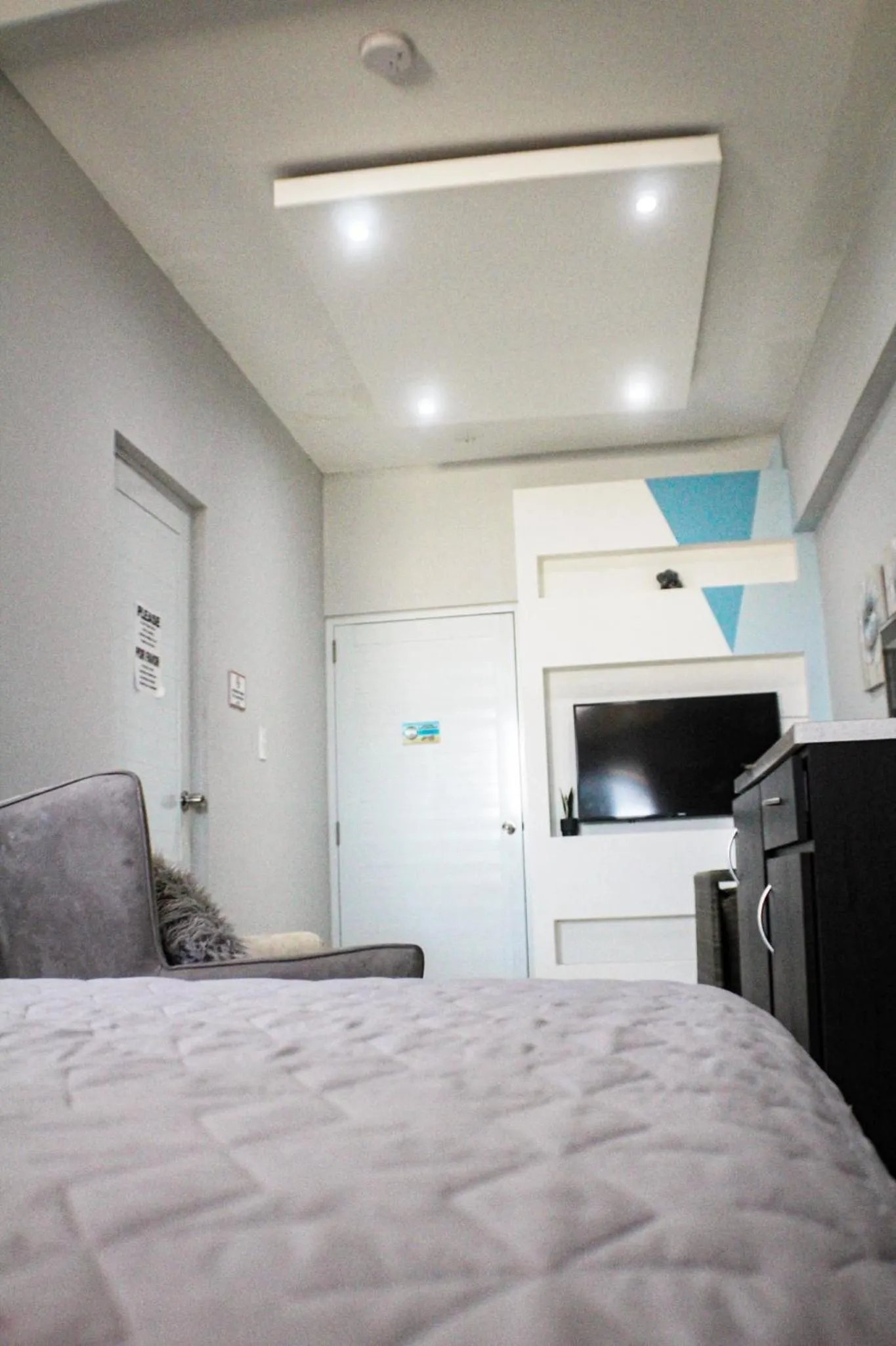 Bed in Itza-Bella Suites