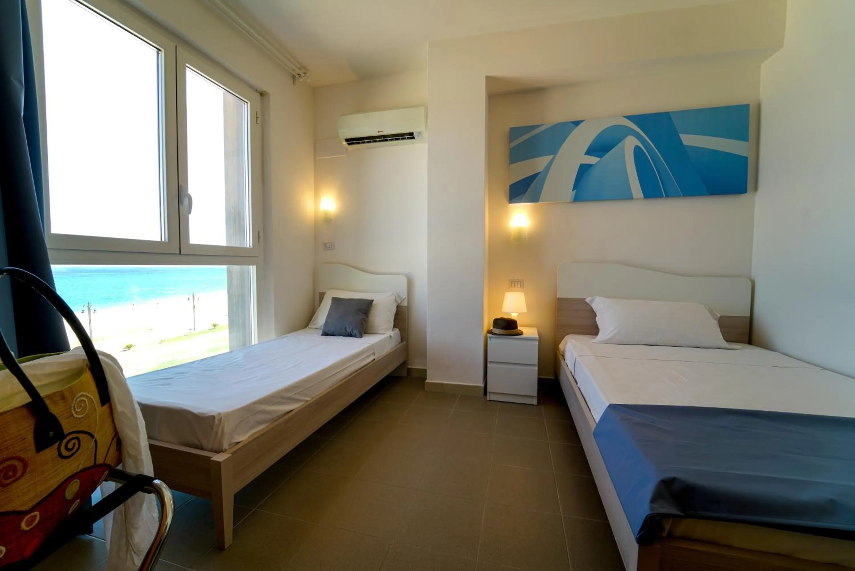 Bed in Hotel Rivabella