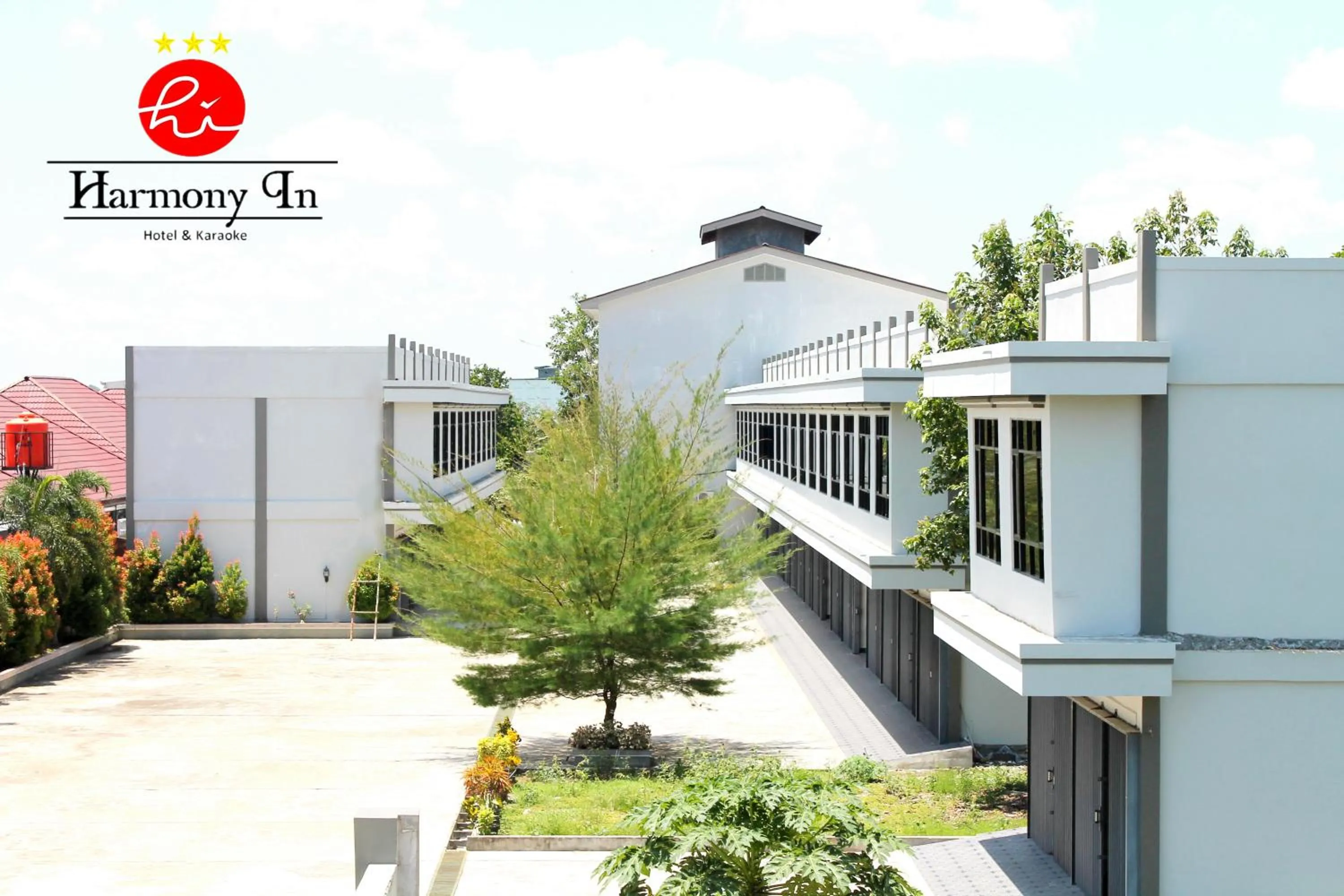 Property building in Hotel Harmony In & Karaoke