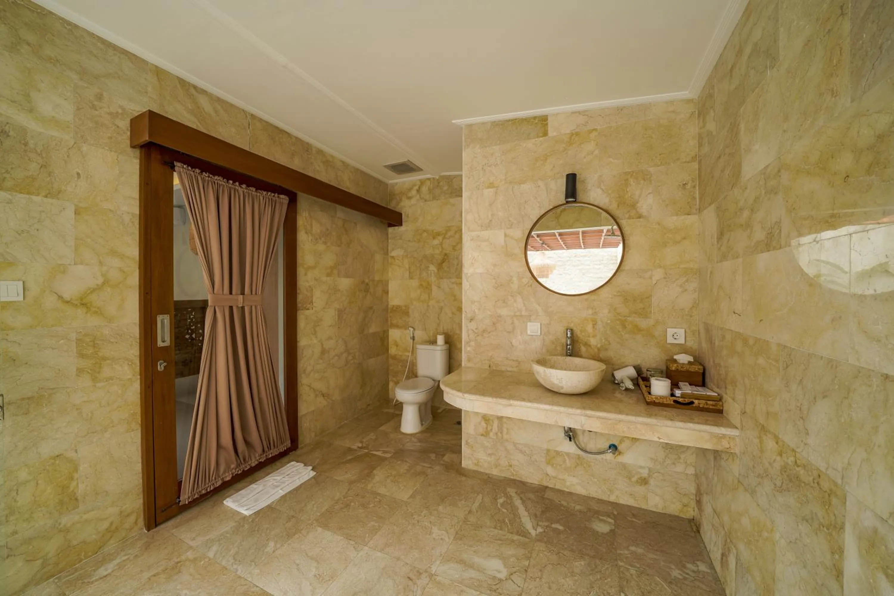 Toilet in Three Brothers Bali Legian Bungalows & Villas