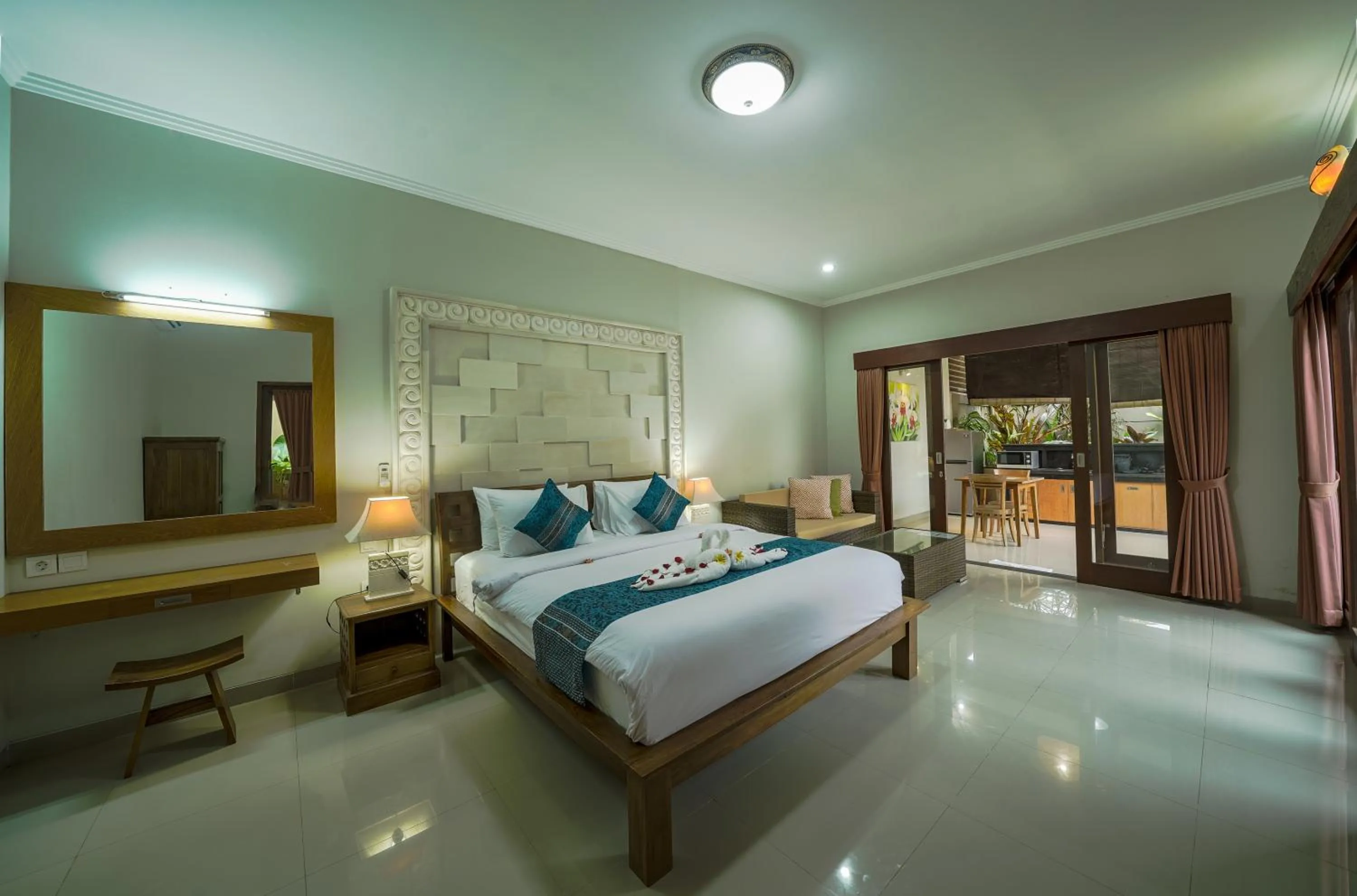 Bed in Three Brothers Bali Legian Bungalows & Villas