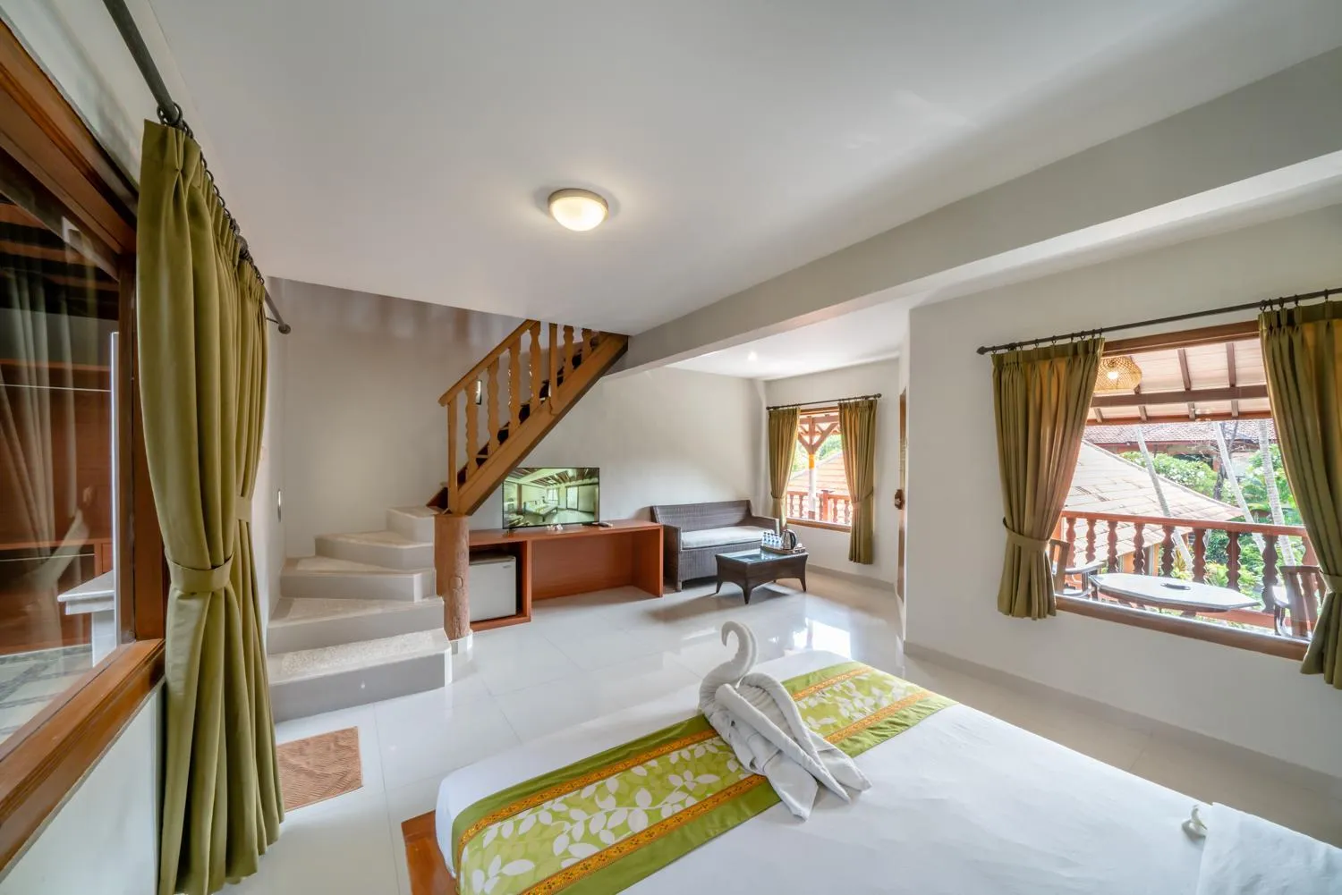 Bed in Three Brothers Bali Legian Bungalows & Villas