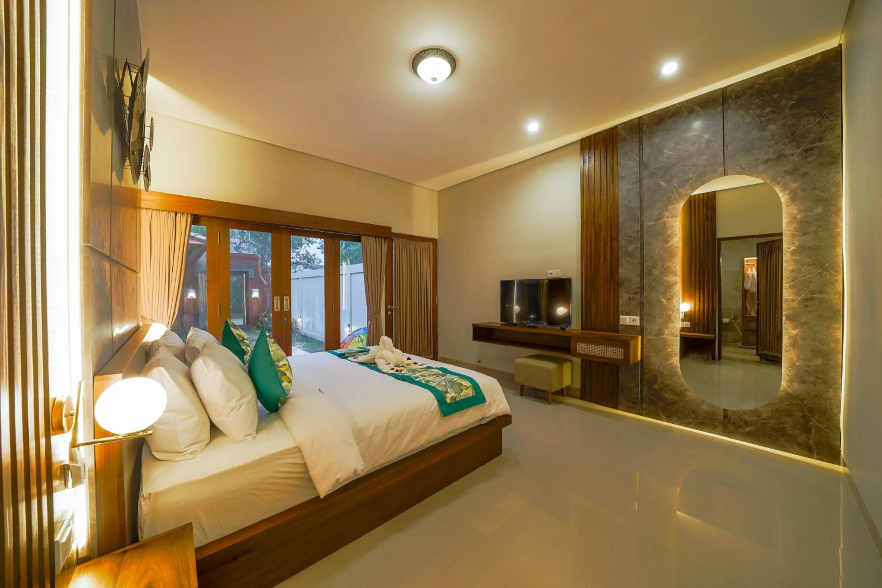 Bed in Three Brothers Bali Legian Bungalows & Villas