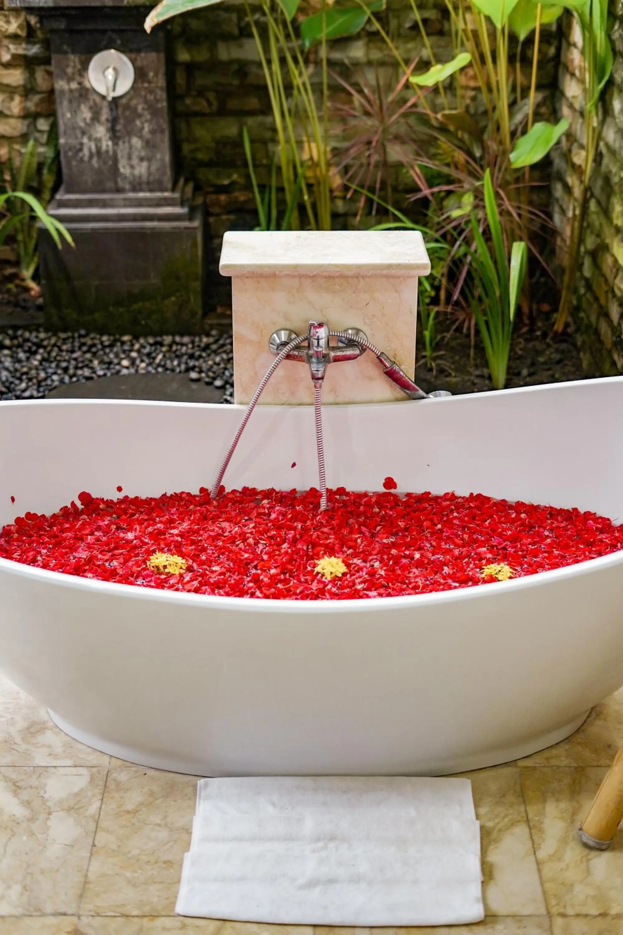 Bathroom in Three Brothers Bali Legian Bungalows & Villas