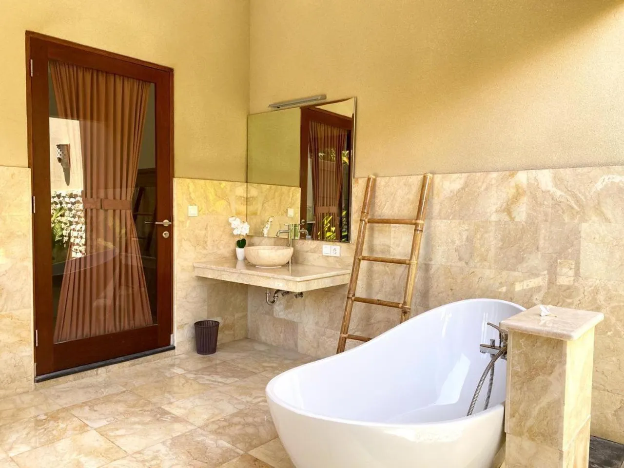 Bathroom in Three Brothers Bali Legian Bungalows & Villas