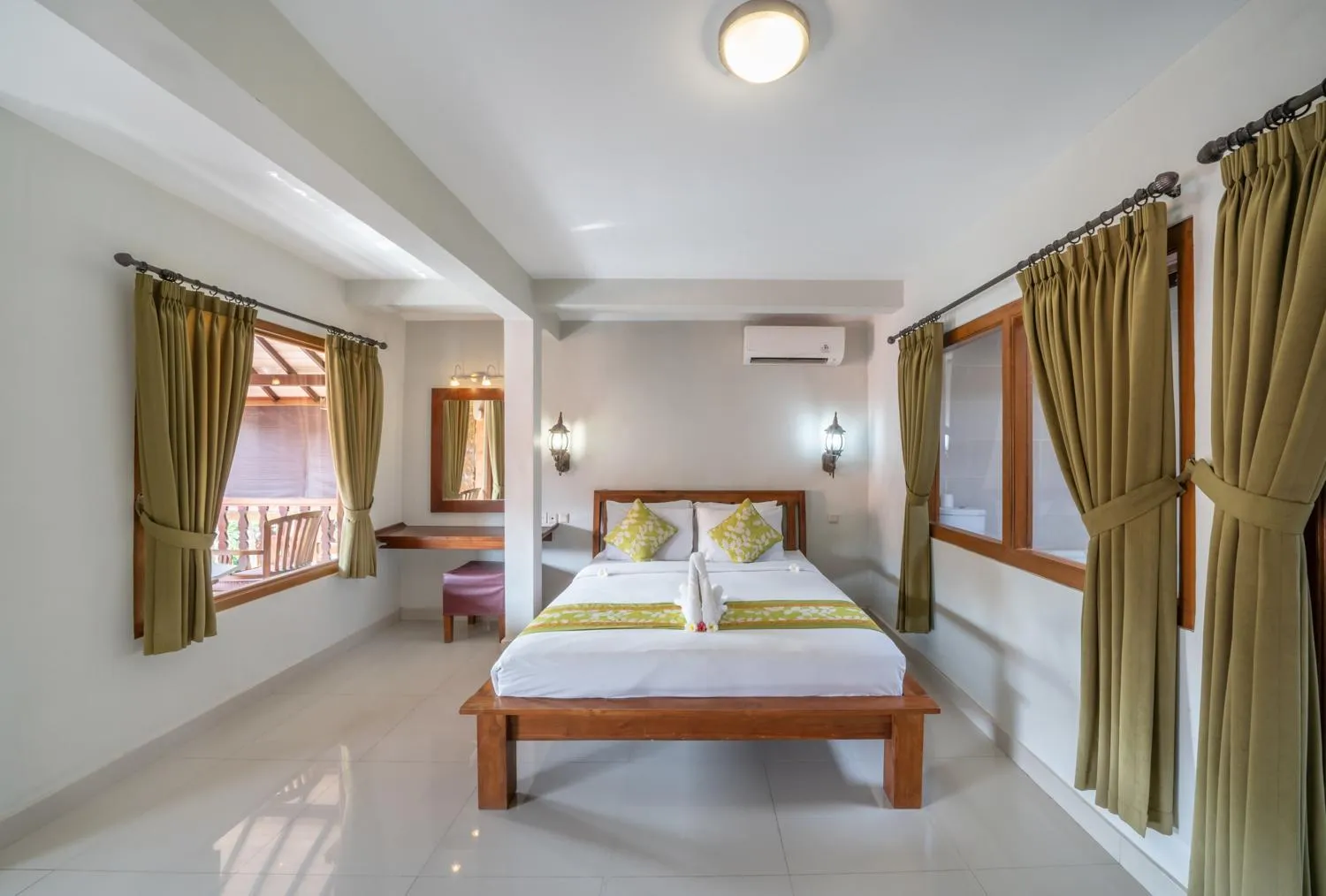 Bed in Three Brothers Bali Legian Bungalows & Villas