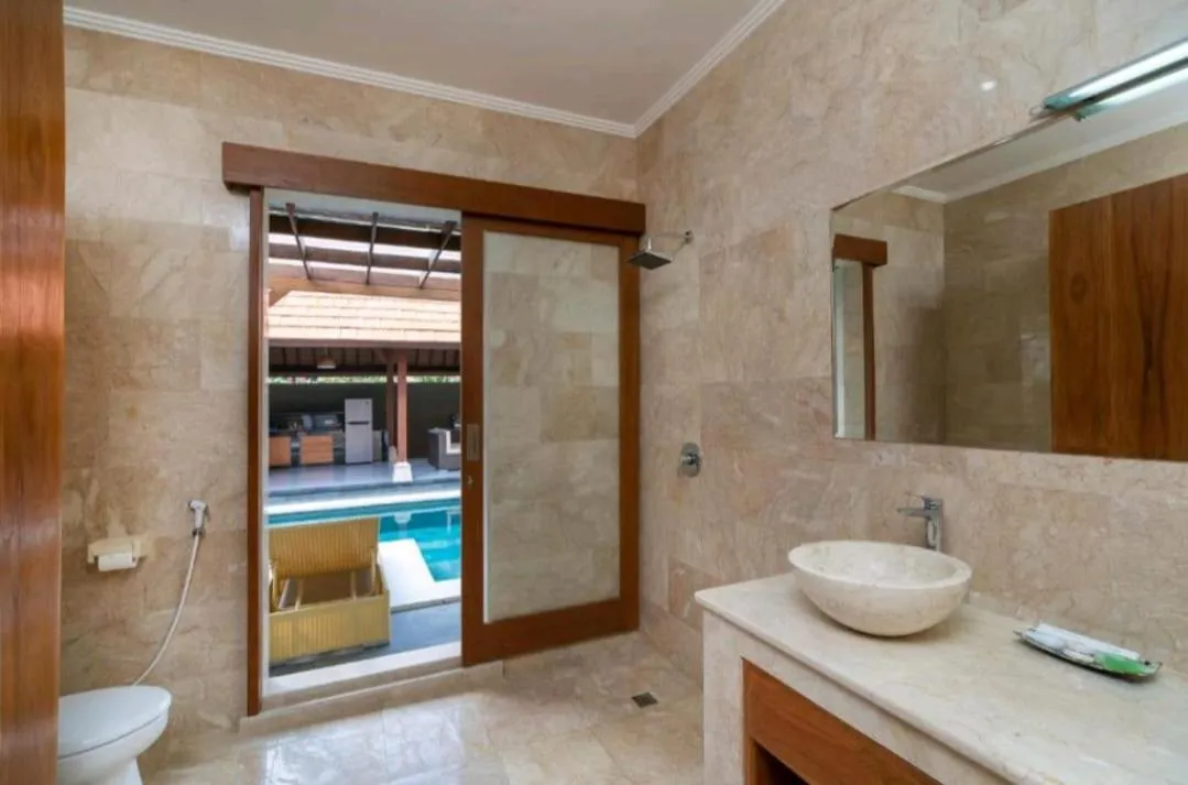 Bathroom in Three Brothers Bali Legian Bungalows & Villas