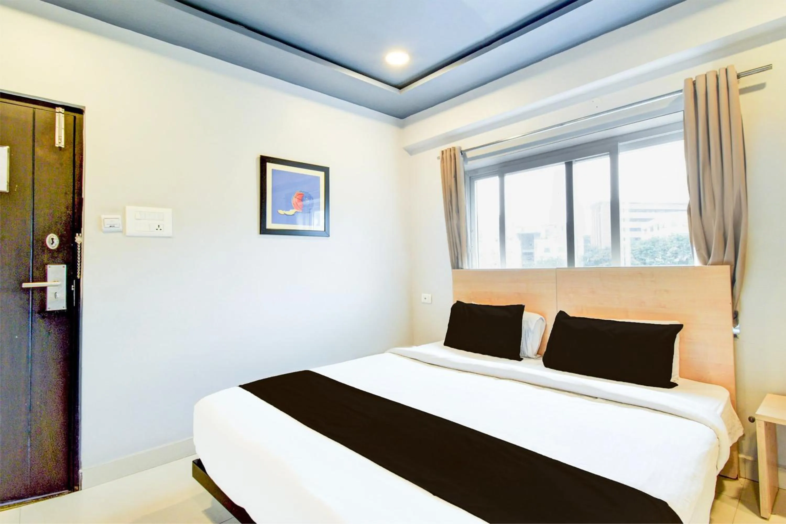 Bedroom, Bed in Super Townhouse HiTech city Hyderabad