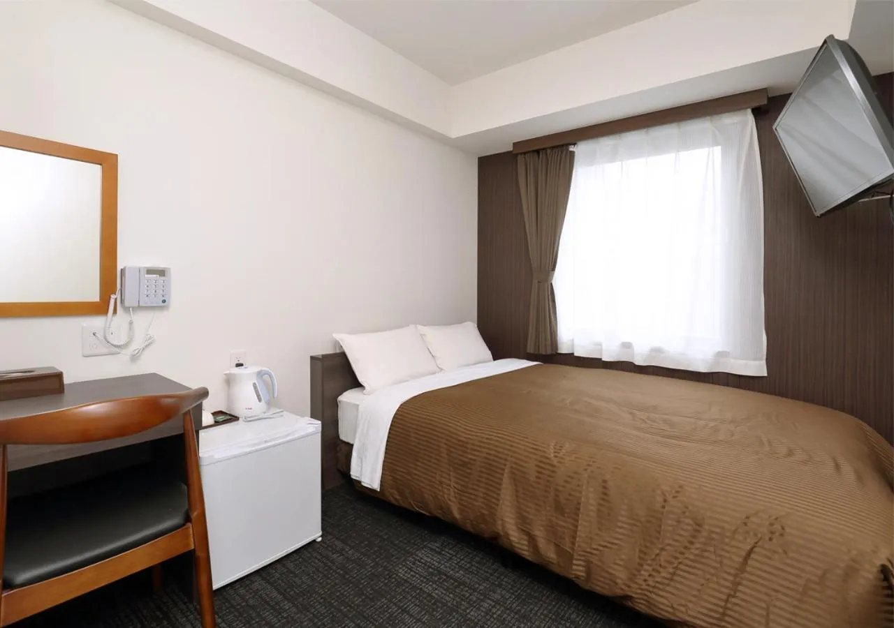 Photo of the whole room, Bed in Hotel Trend Okayama Ekimae