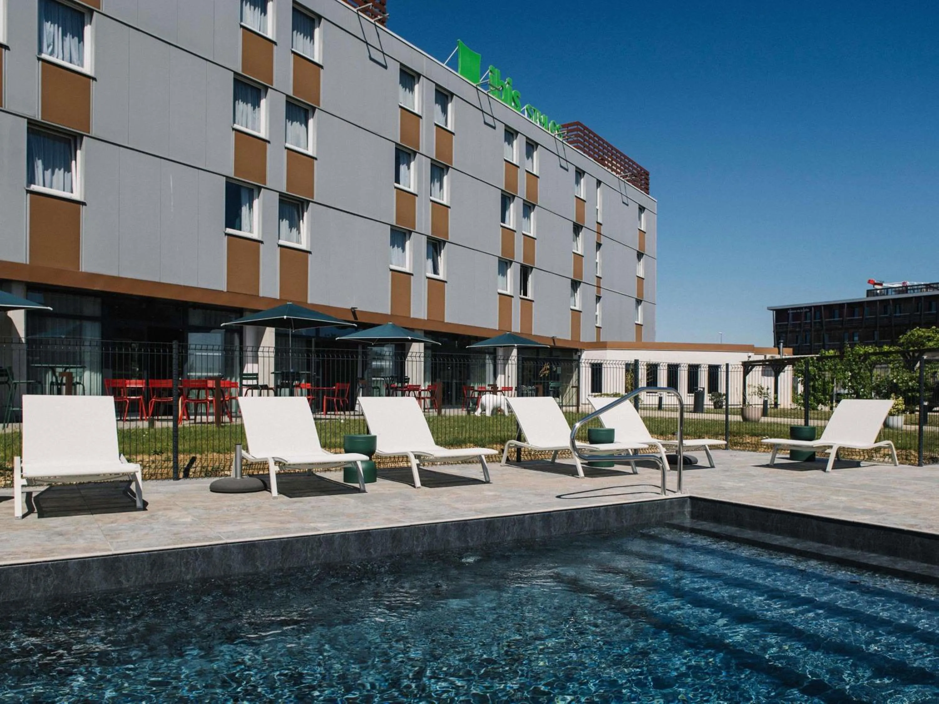 Pool view in Ibis Styles Dijon Nord Valmy