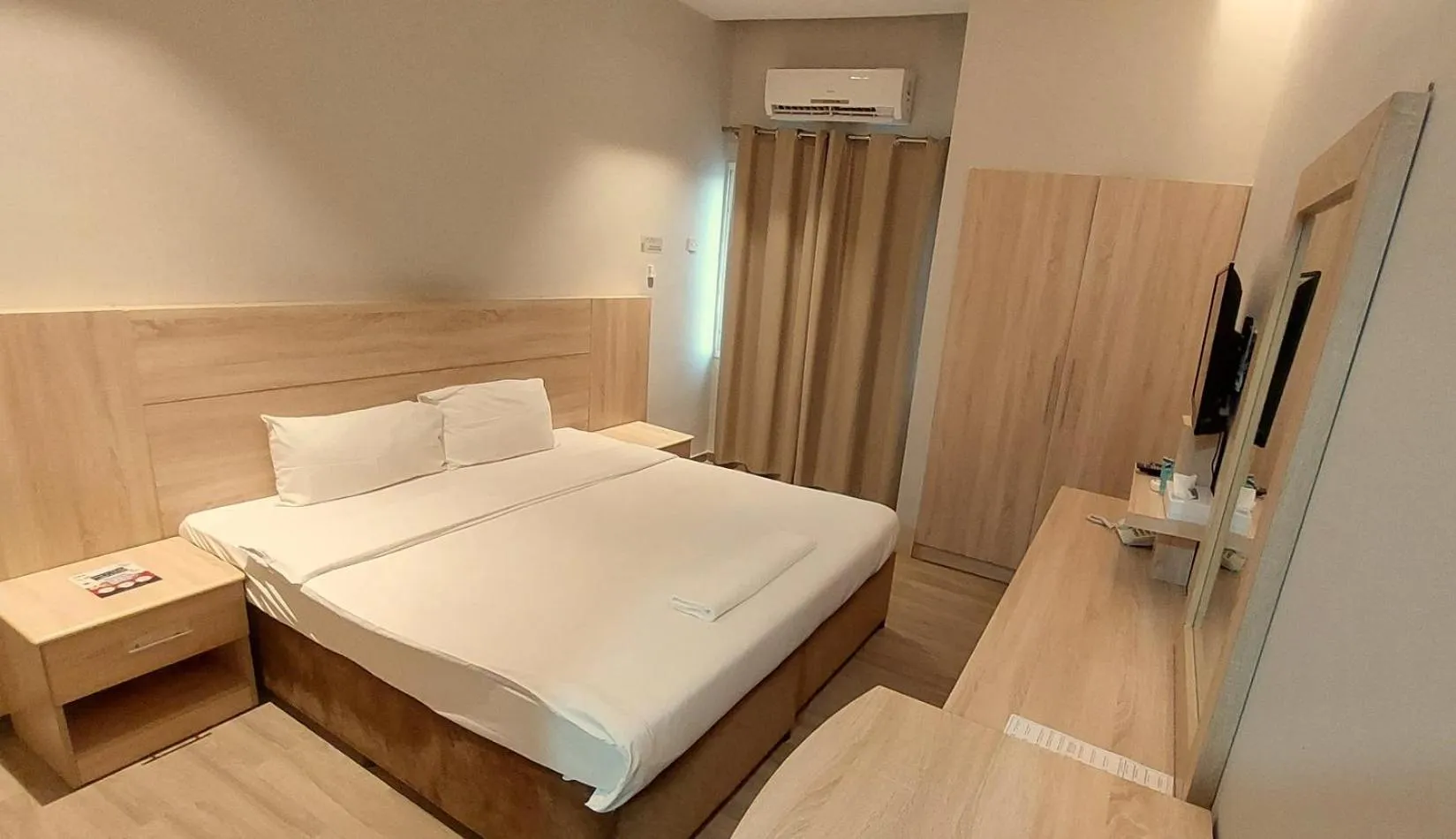 Bed in Grand Flora Hotel