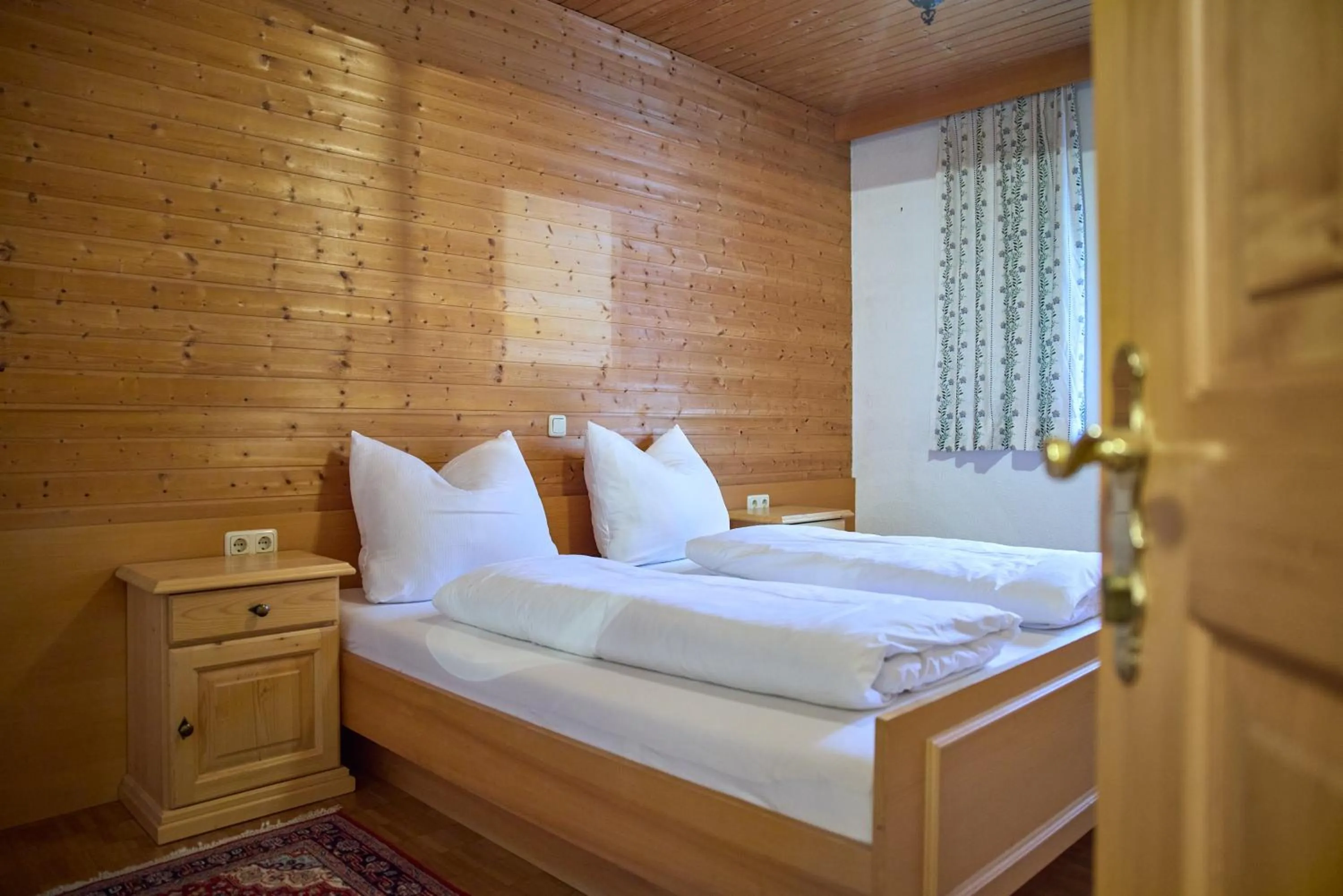 Bed in Alt Montafon Hotel Appartements by Pferd auf Wolke