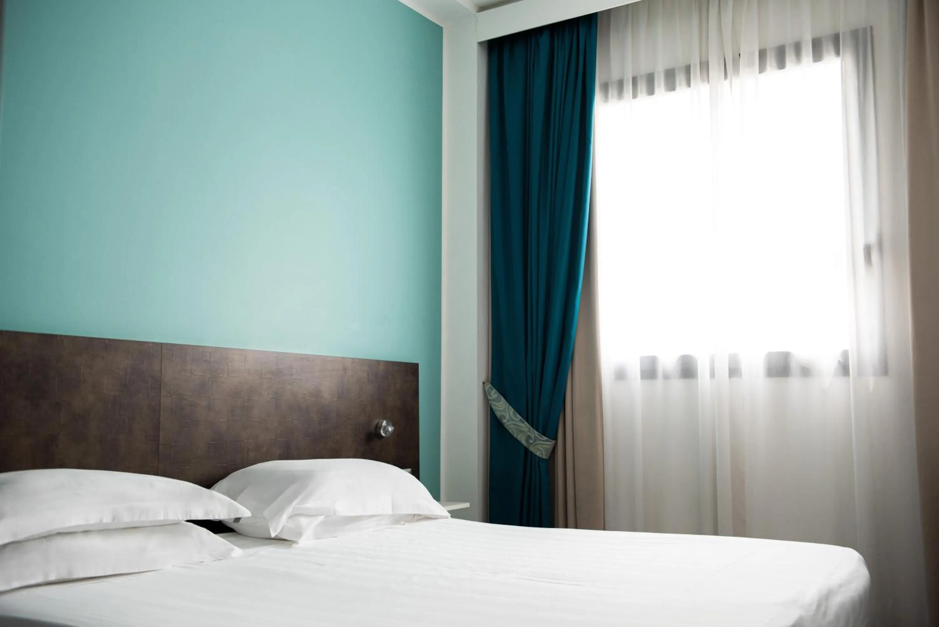 Bed in Phi Hotel Milano