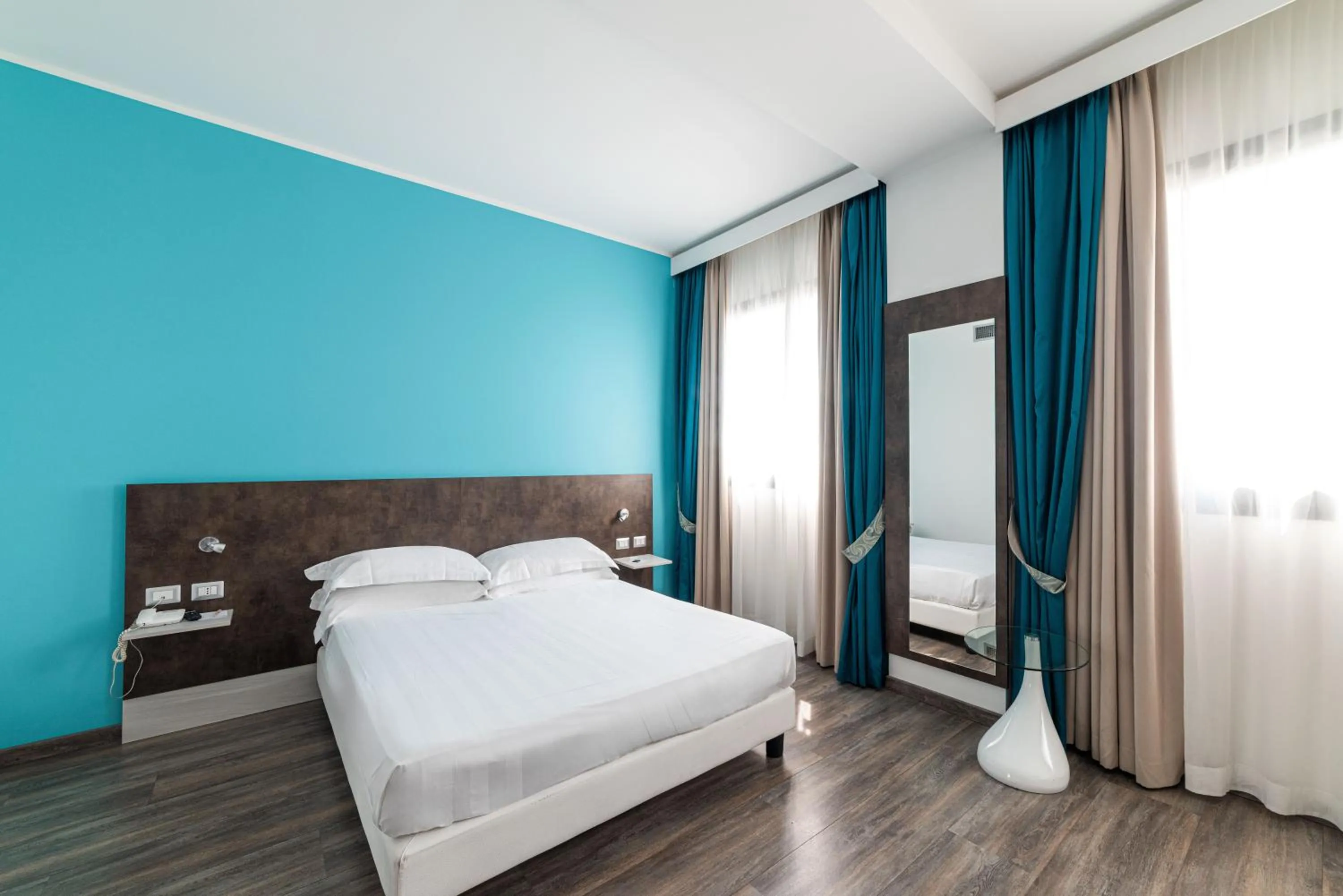 Bed in Phi Hotel Milano