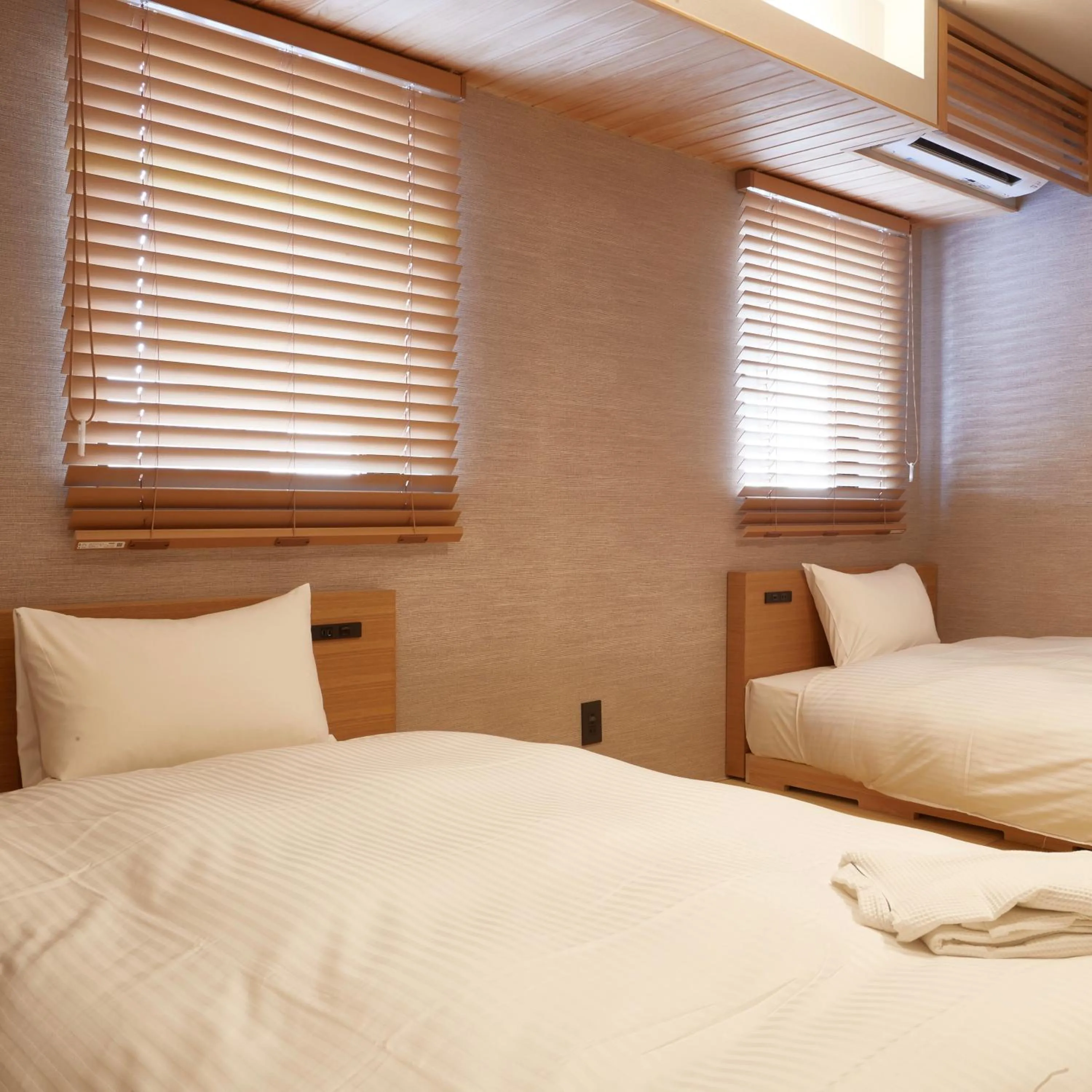 Bed in KAMAKURA Hotel