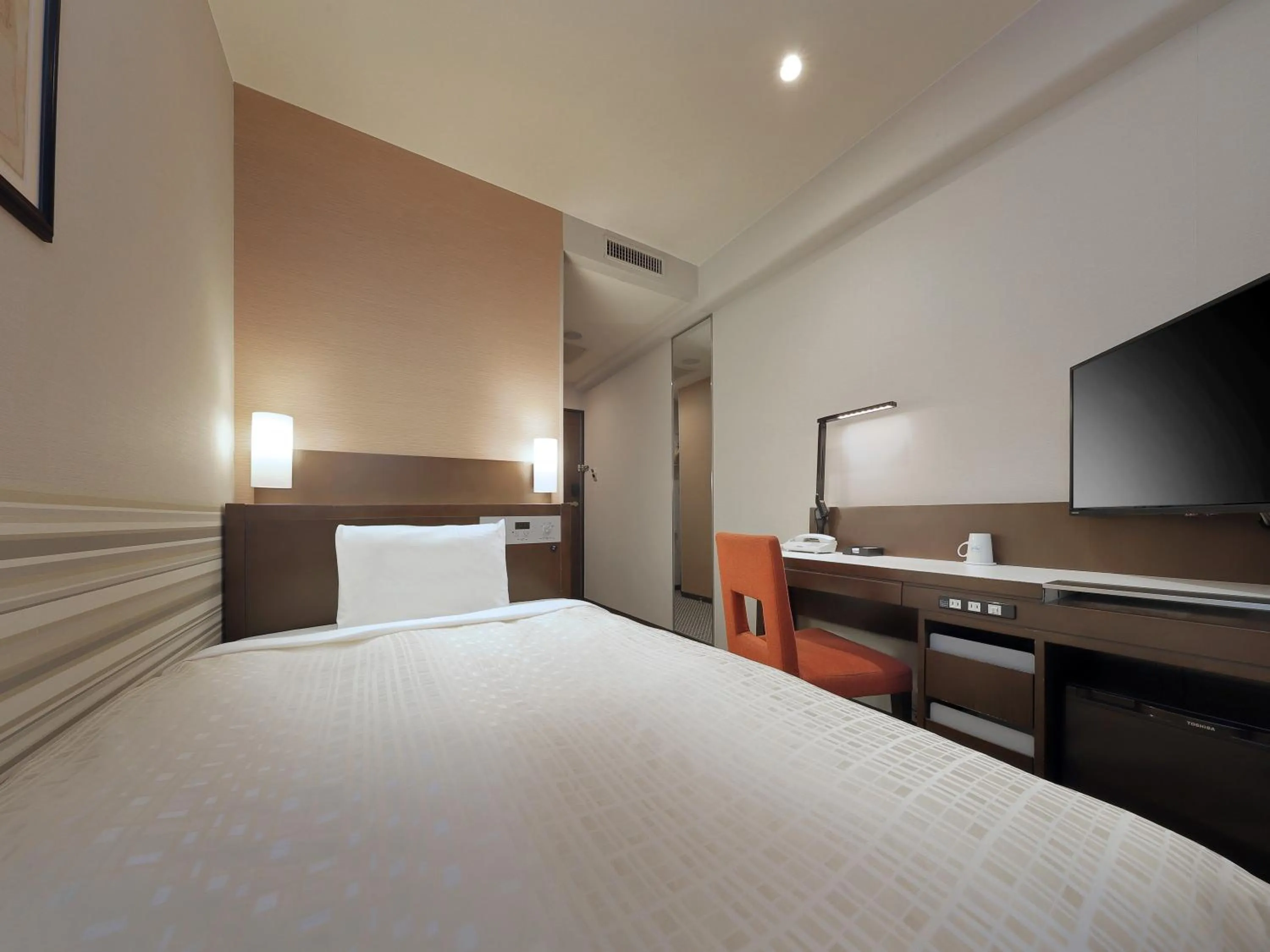 Bed in Keio Presso Inn Kanda