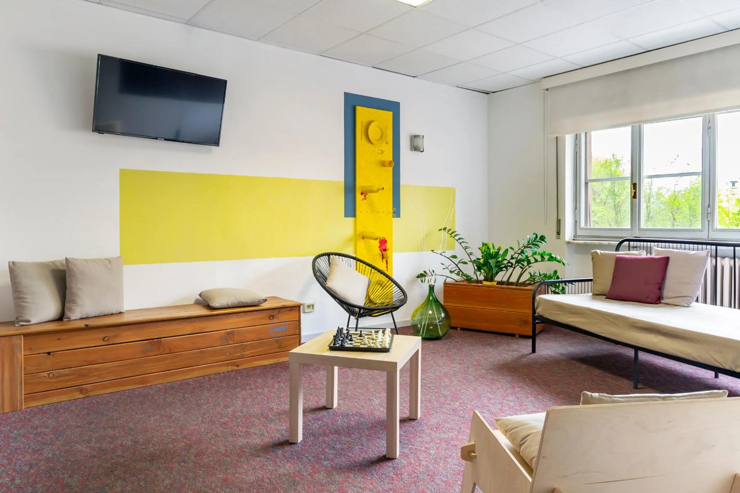 Communal lounge/ TV room in UniHo Hostel