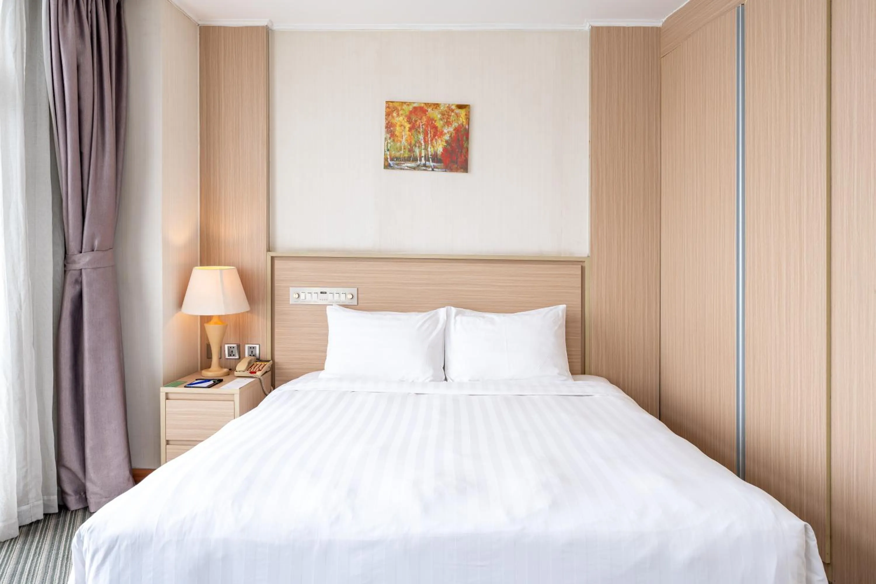 Bed in Super Candle Hotel