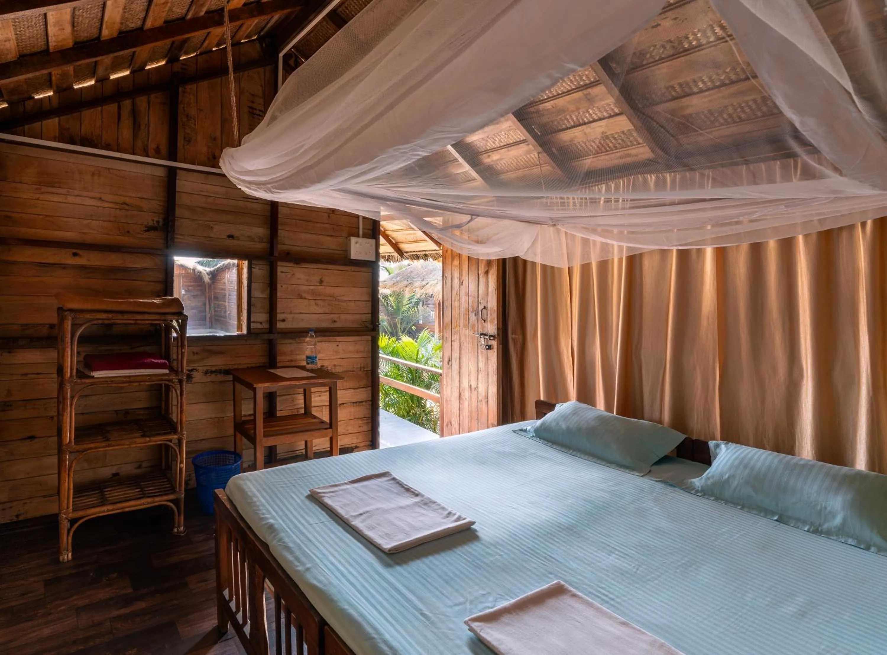Bed in Blue Corner Beach Huts & Restaurant