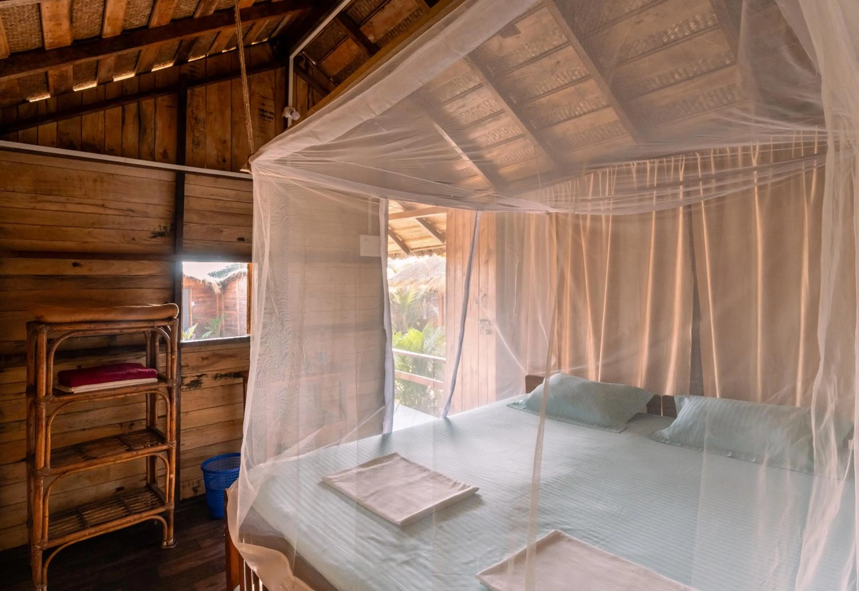 Bed in Blue Corner Beach Huts & Restaurant