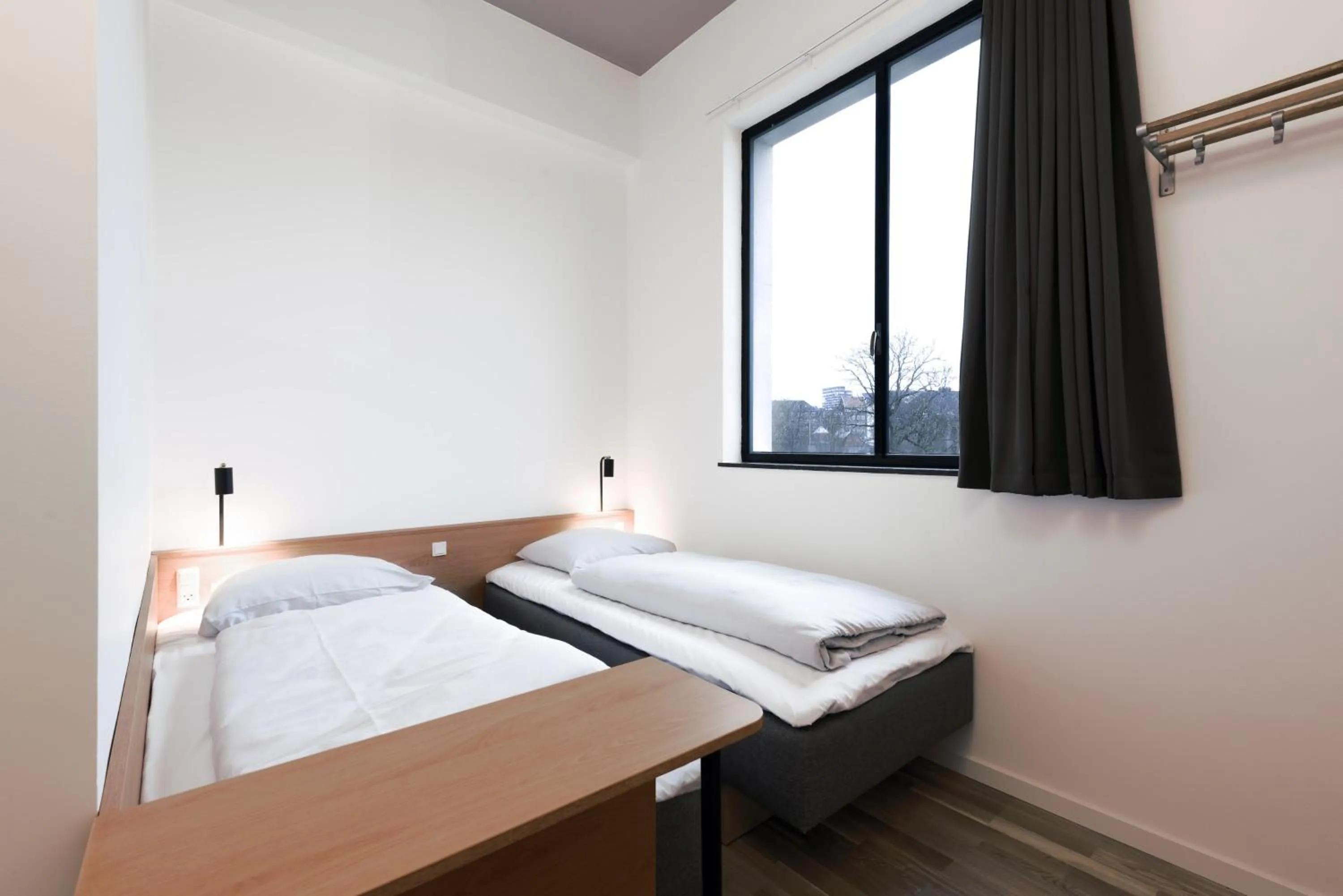 Bed in BOOK1 by Brøchner Hotels