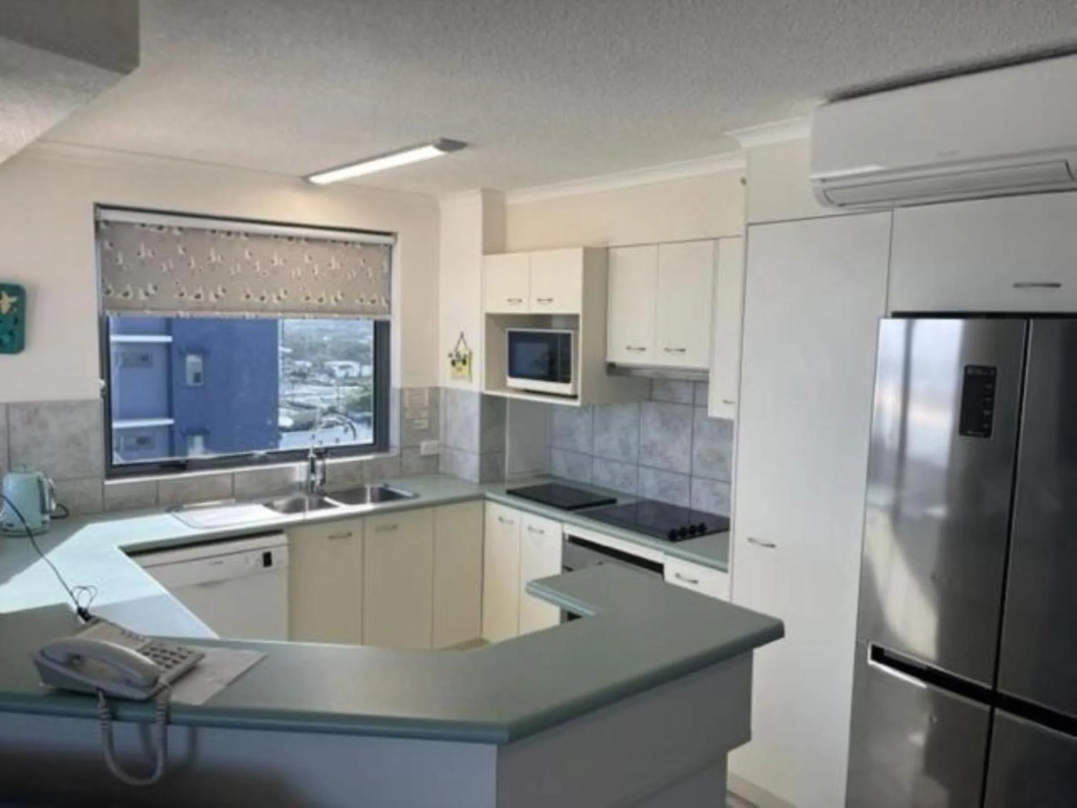 Kitchen or kitchenette in Centrepoint Apartments Caloundra