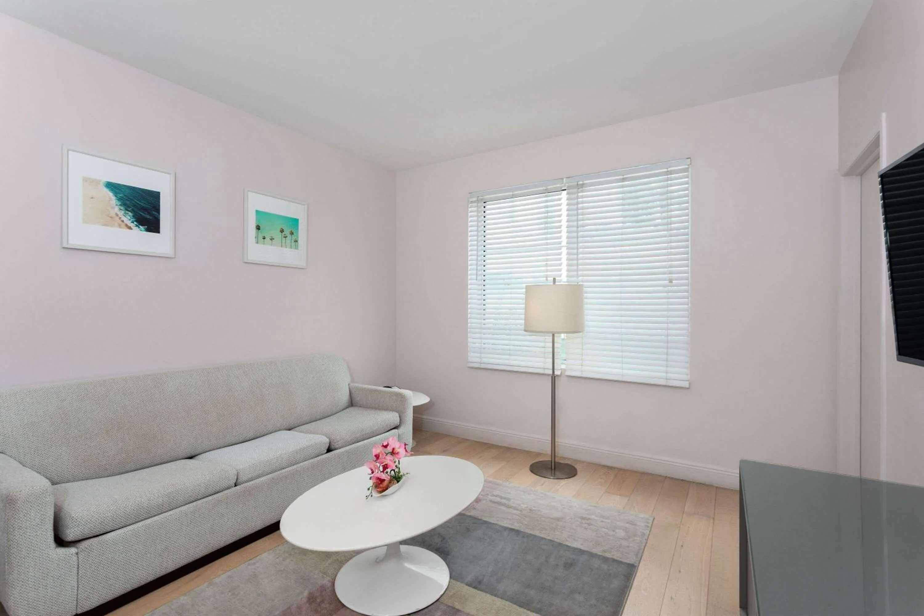 Bed, Seating Area in The Astor by LuxUrban