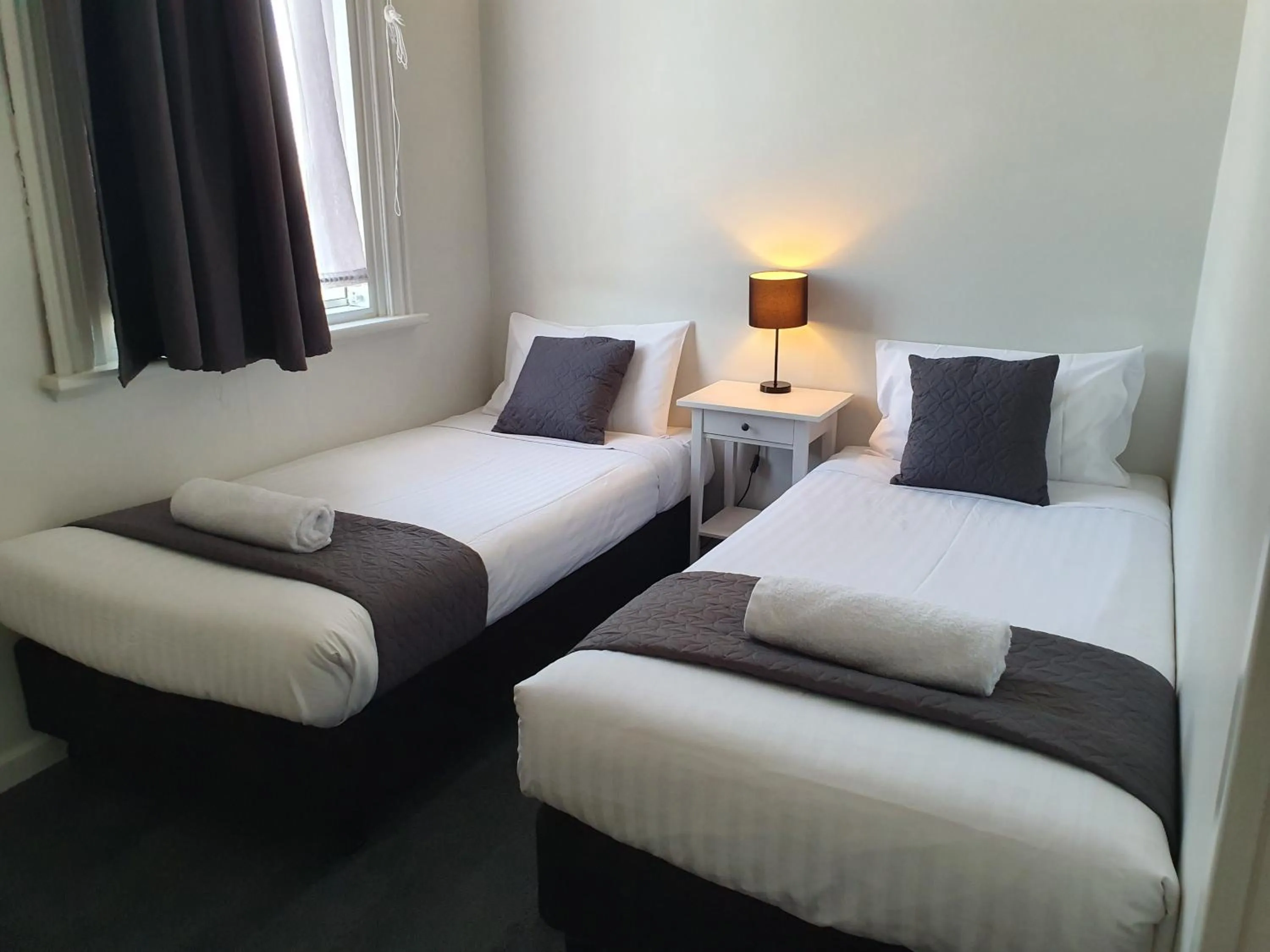 Bed in The Parade Hotel