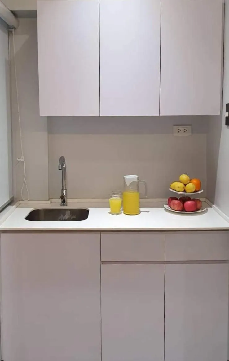 Kitchen or kitchenette in Radlett Residences Hotel - Tuguegarao