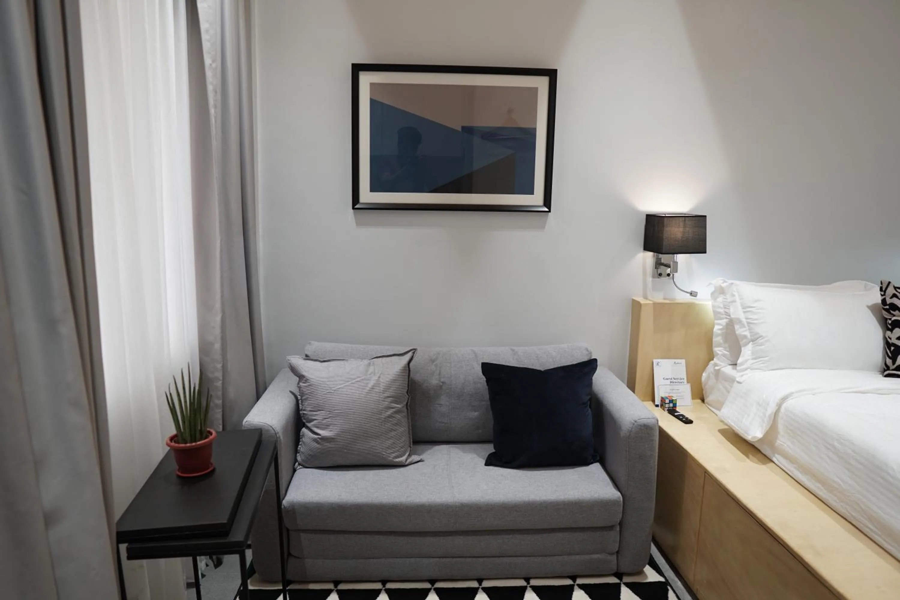 Seating area, Bed in Radlett Residences Hotel - Tuguegarao