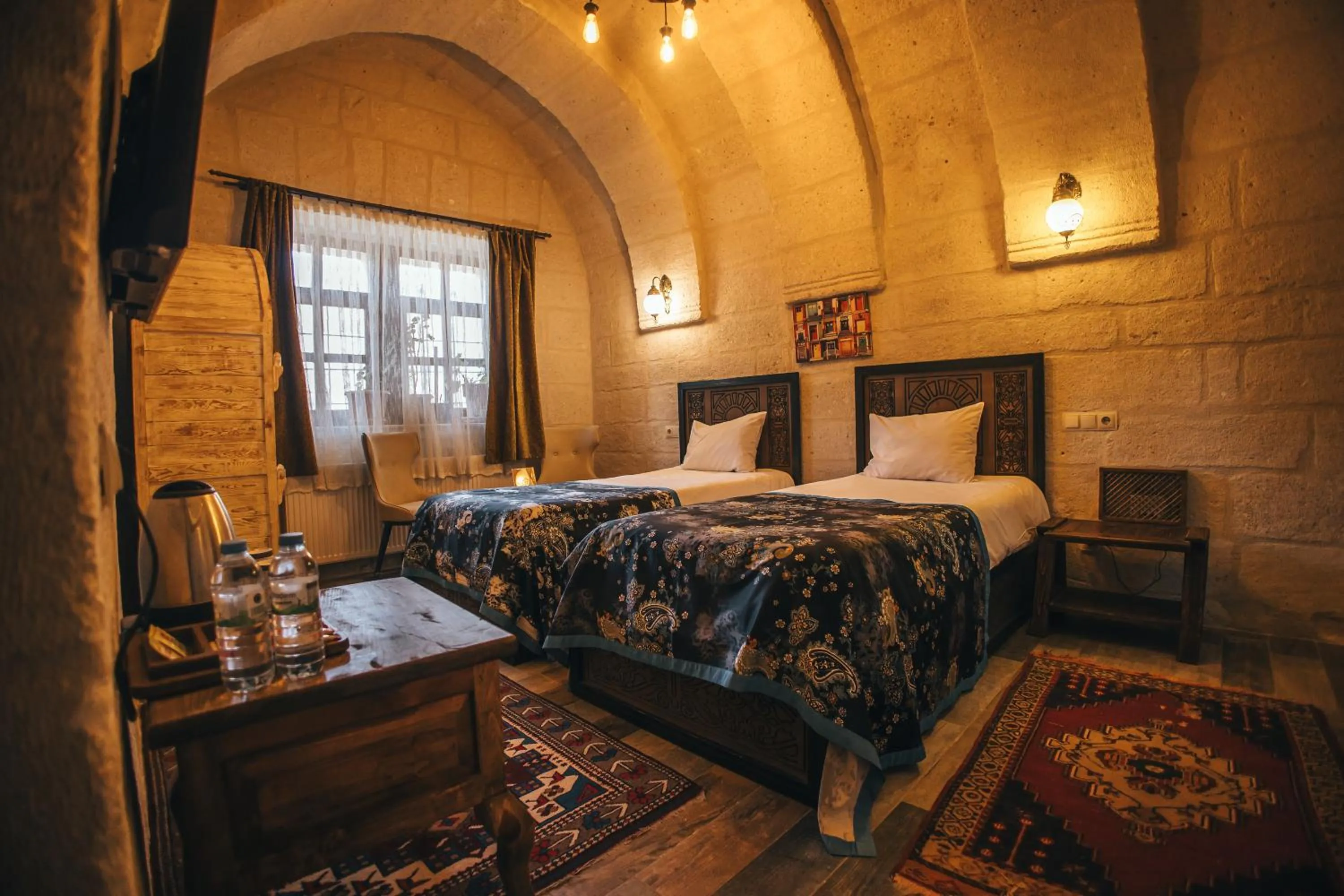 Bed in Vintage Cave House Hotel