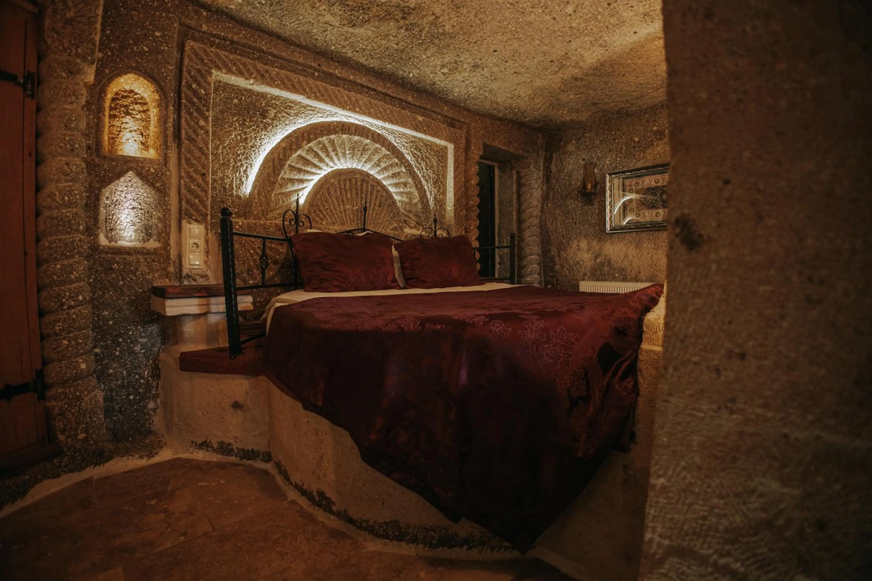 Bed in Vintage Cave House Hotel