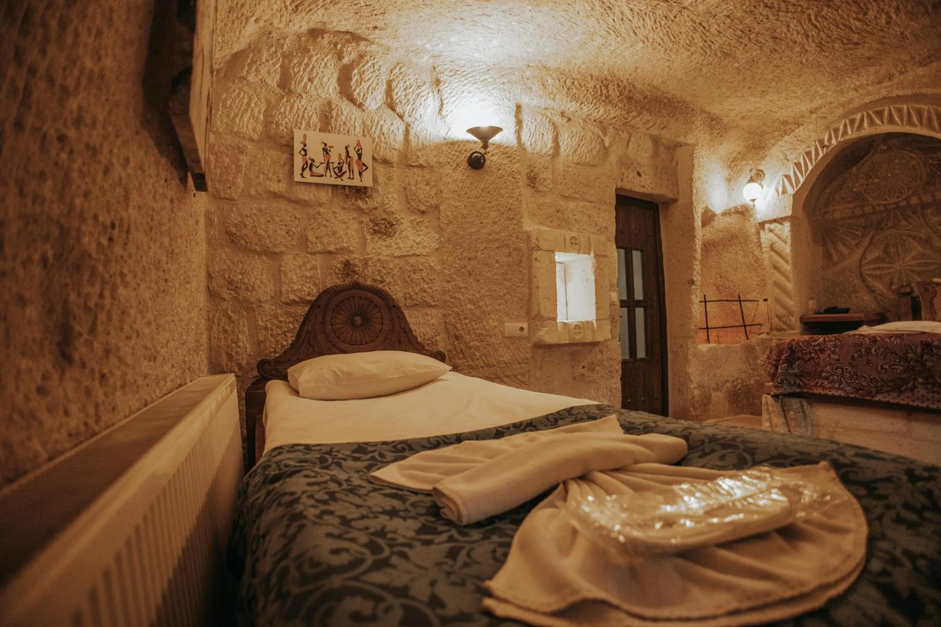 Bed in Vintage Cave House Hotel