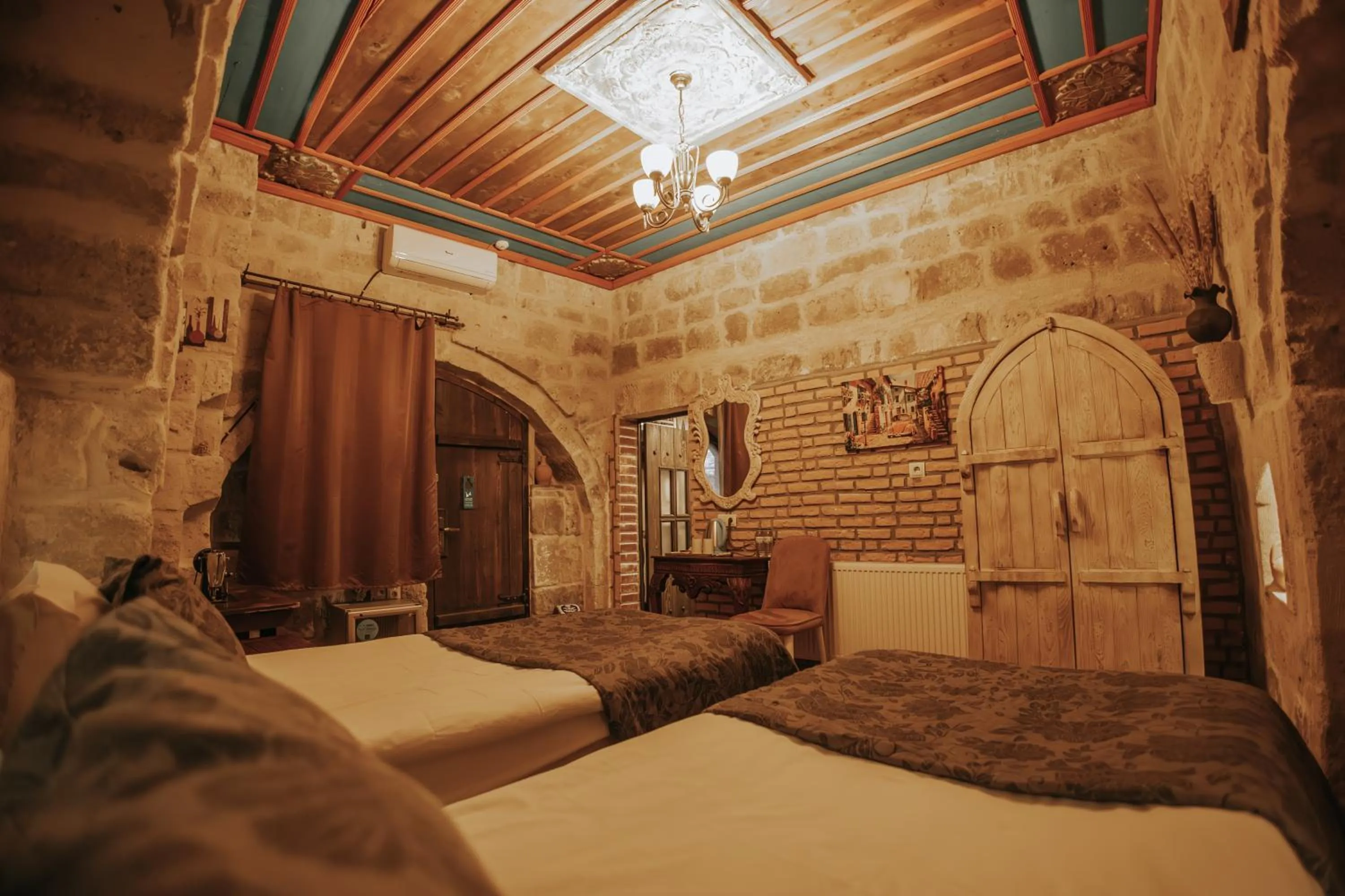 Bed in Vintage Cave House Hotel