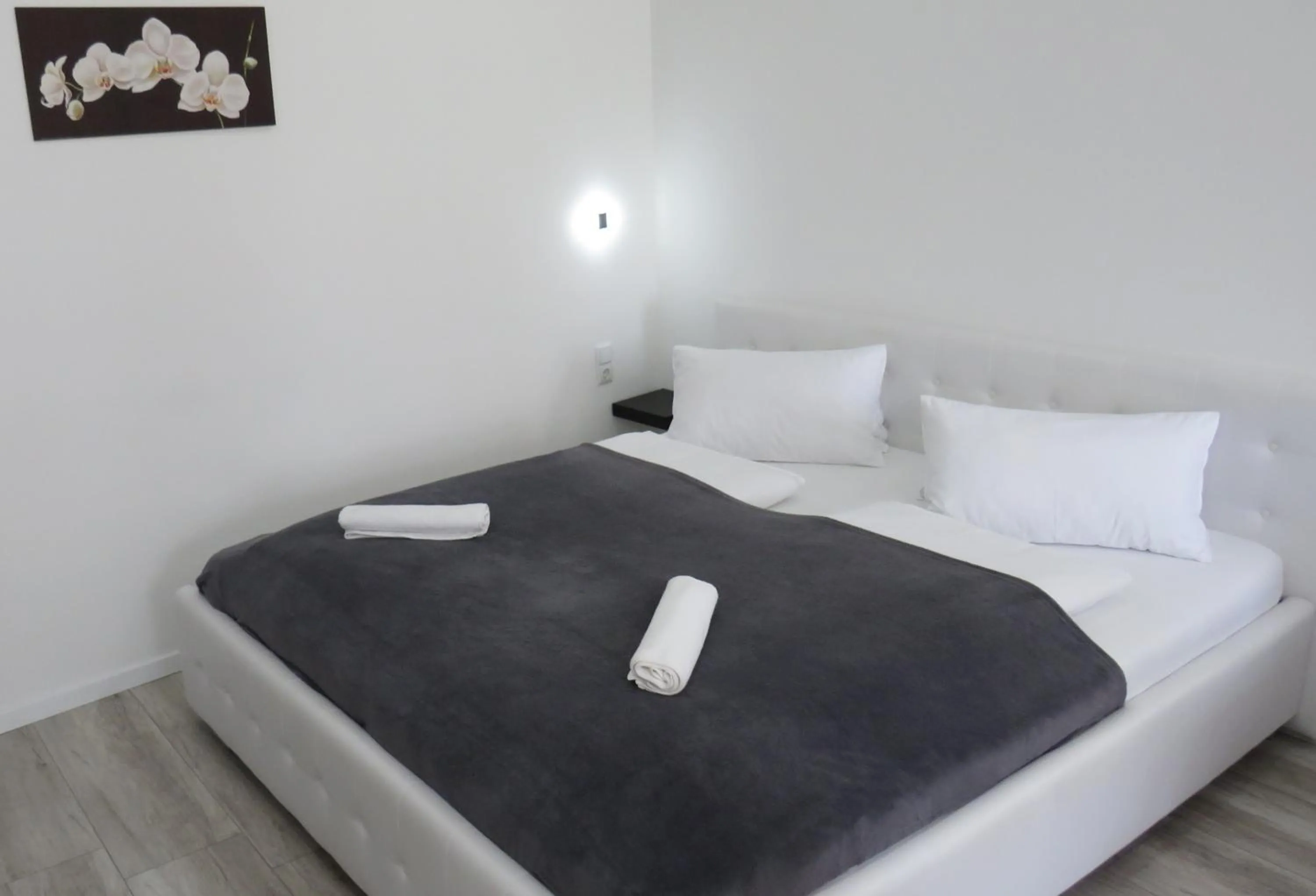 Bed in Aqua Wellness Apartments