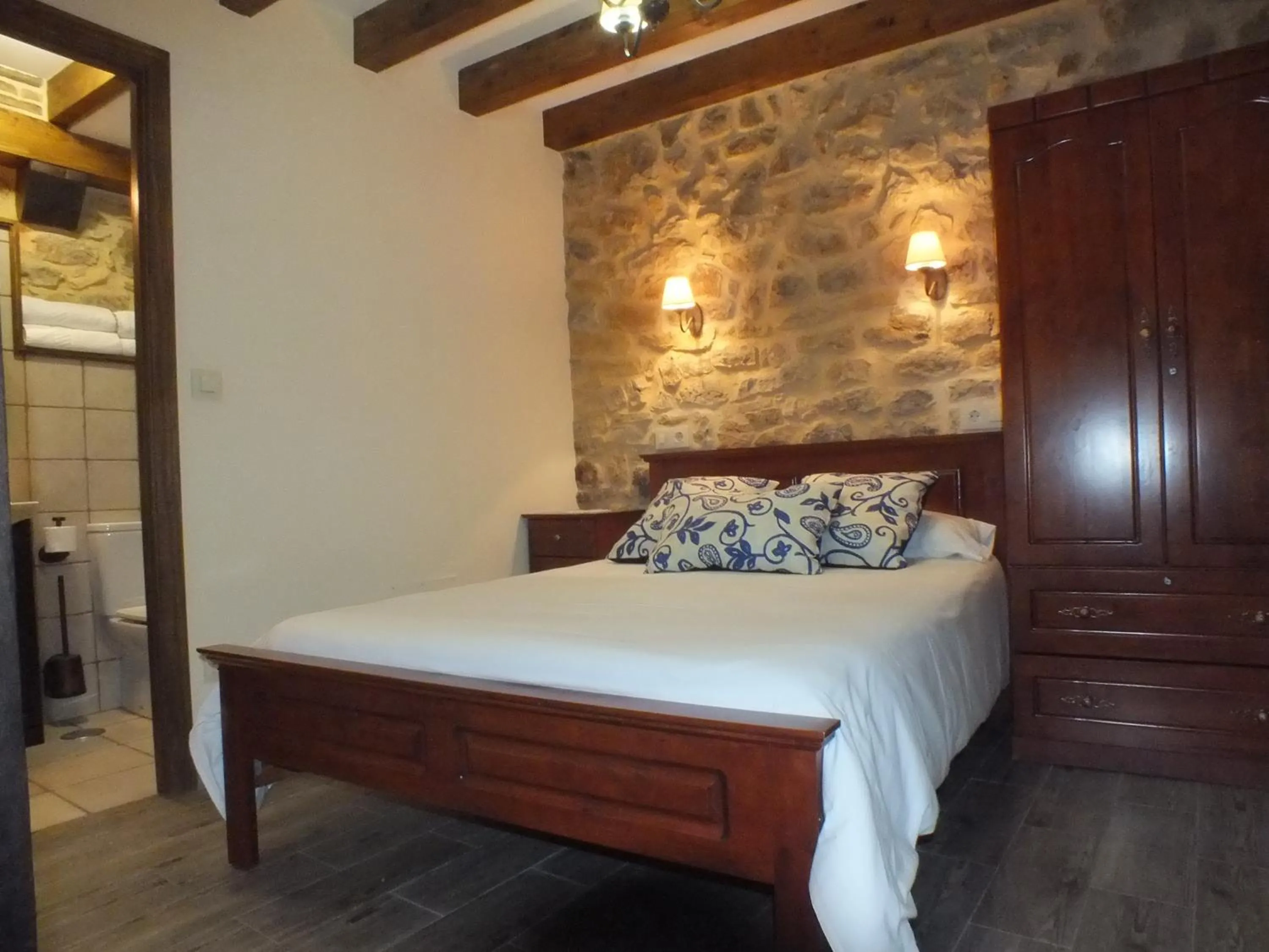 Photo of the whole room, Bed in Apartamentos Legado de Santillana
