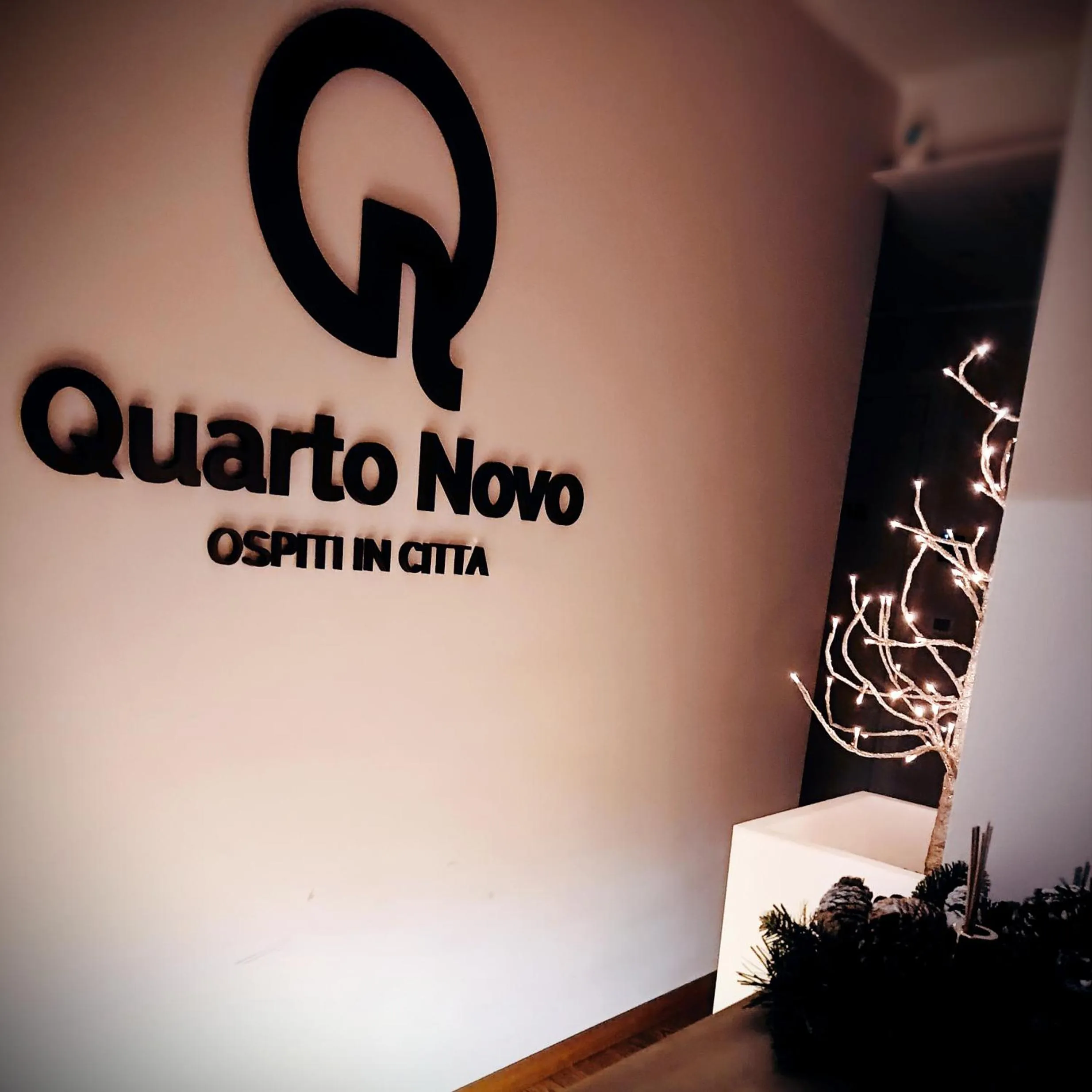 Property logo or sign in Quarto Novo Suite