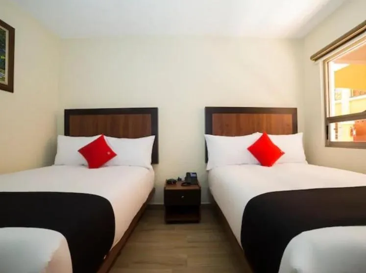 Bed in Hotel Colonial Acopinalco Inn