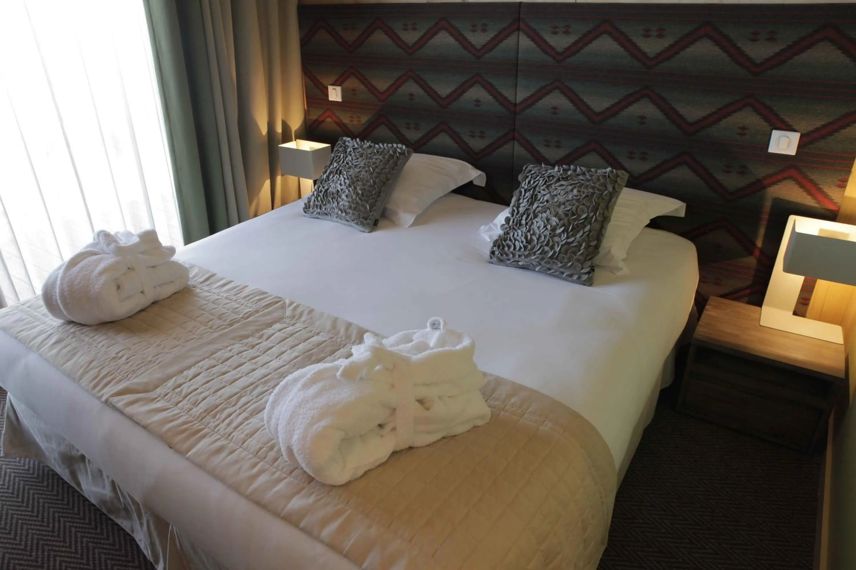 Bed in L'Aiguille Grive Chalets Hotel