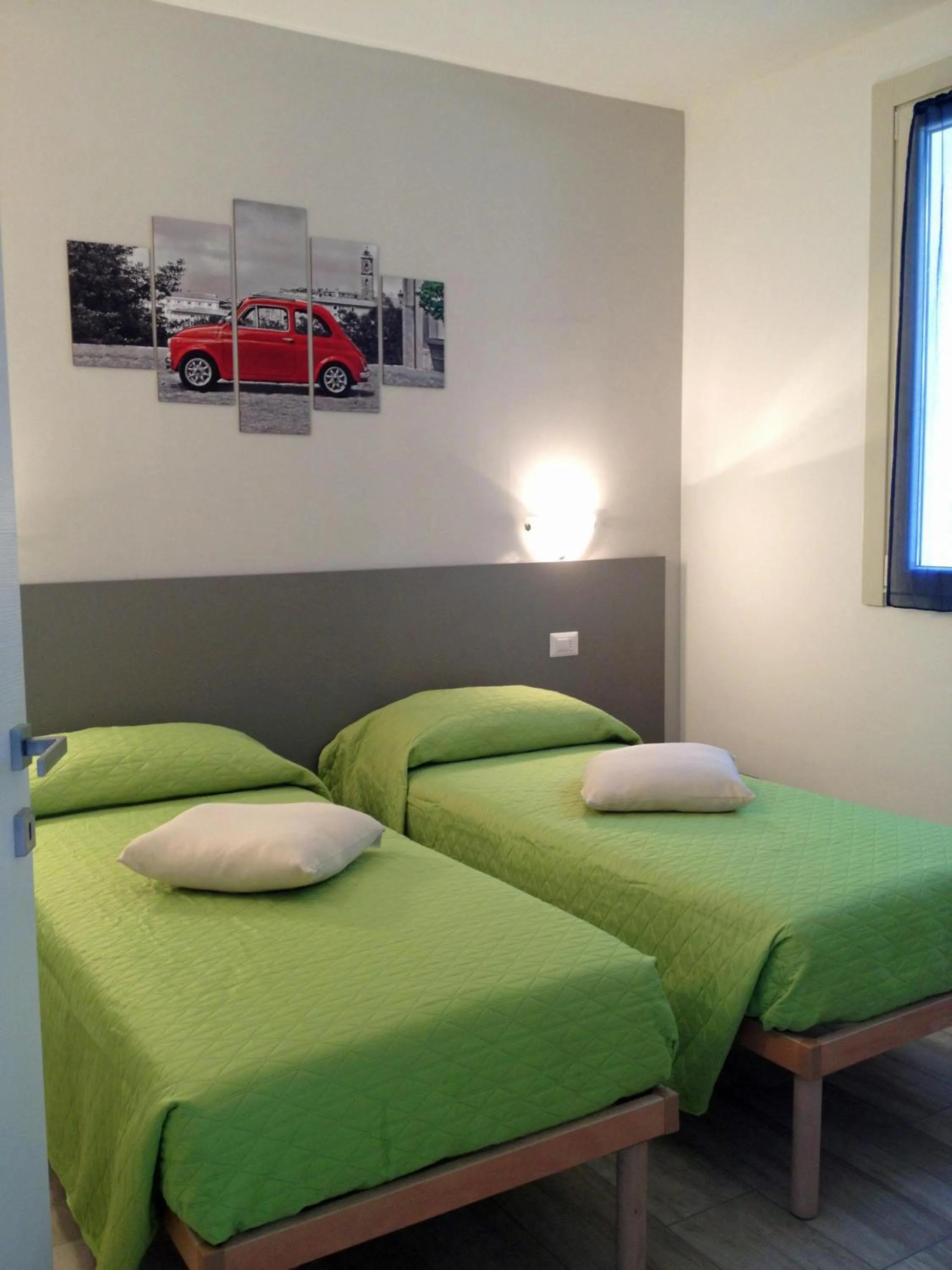 Bedroom in La Collinetta Apartments