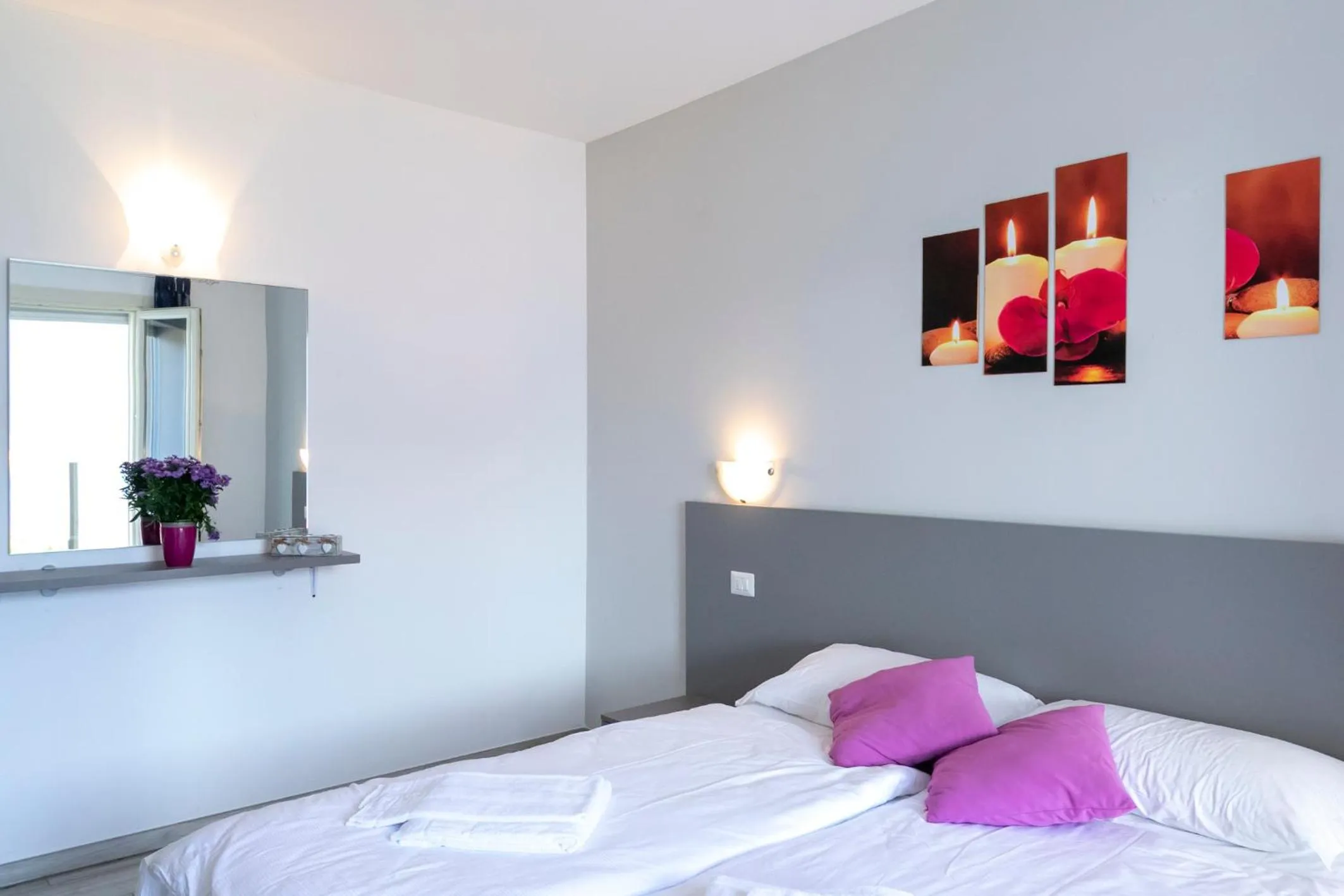 Bedroom in La Collinetta Apartments