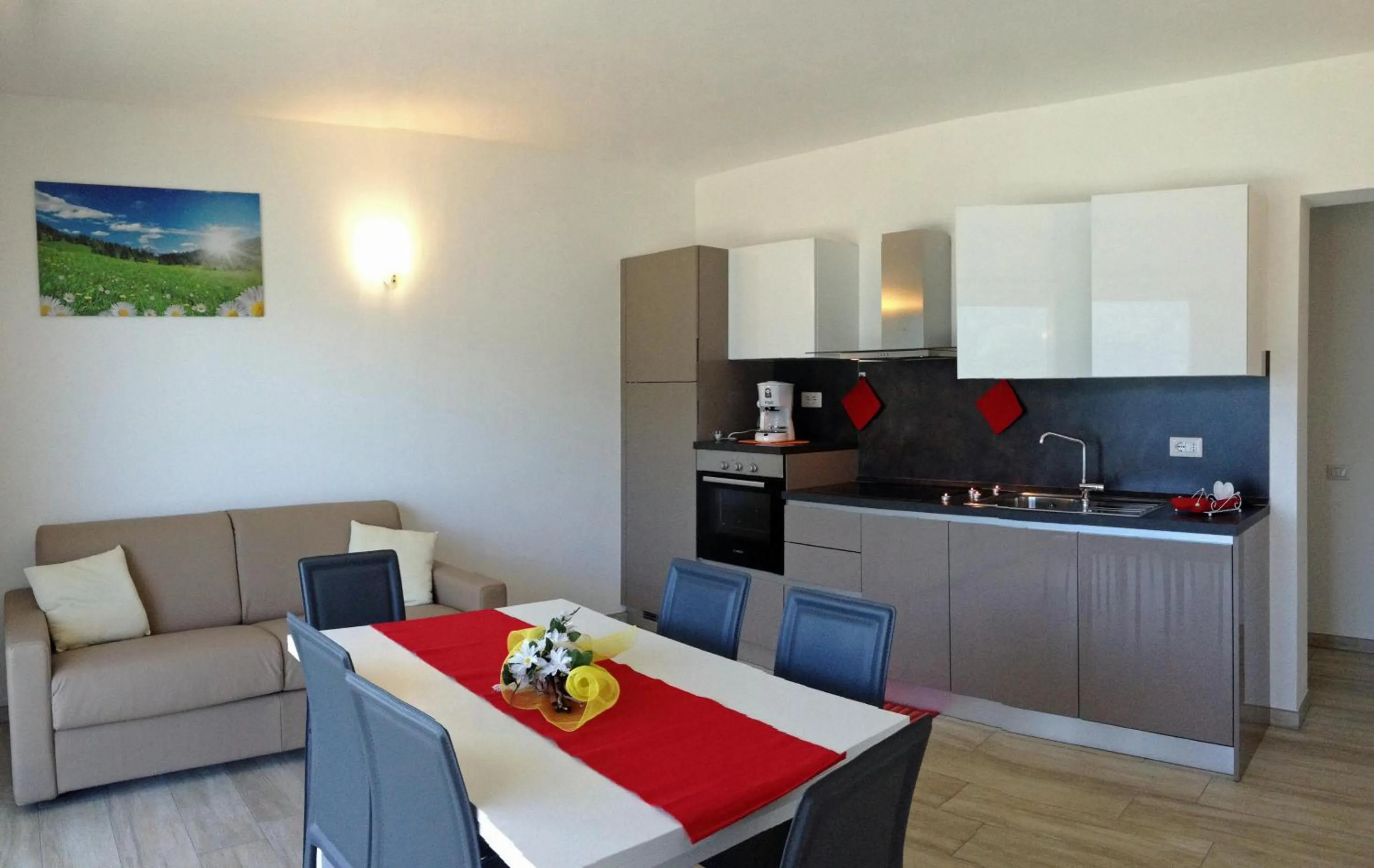 Kitchen or kitchenette in La Collinetta Apartments