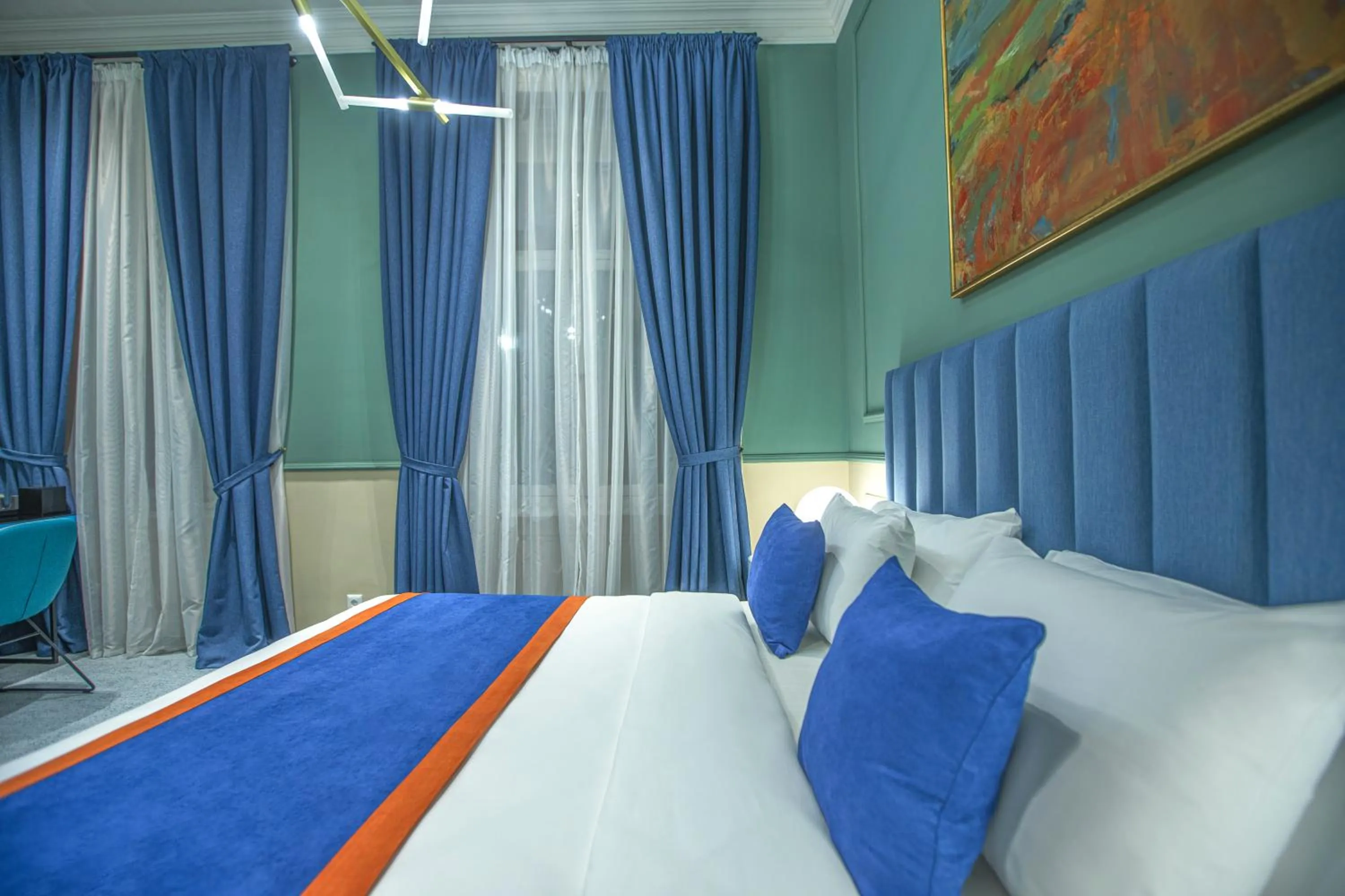 Bed in Heritage Hotel and Suites