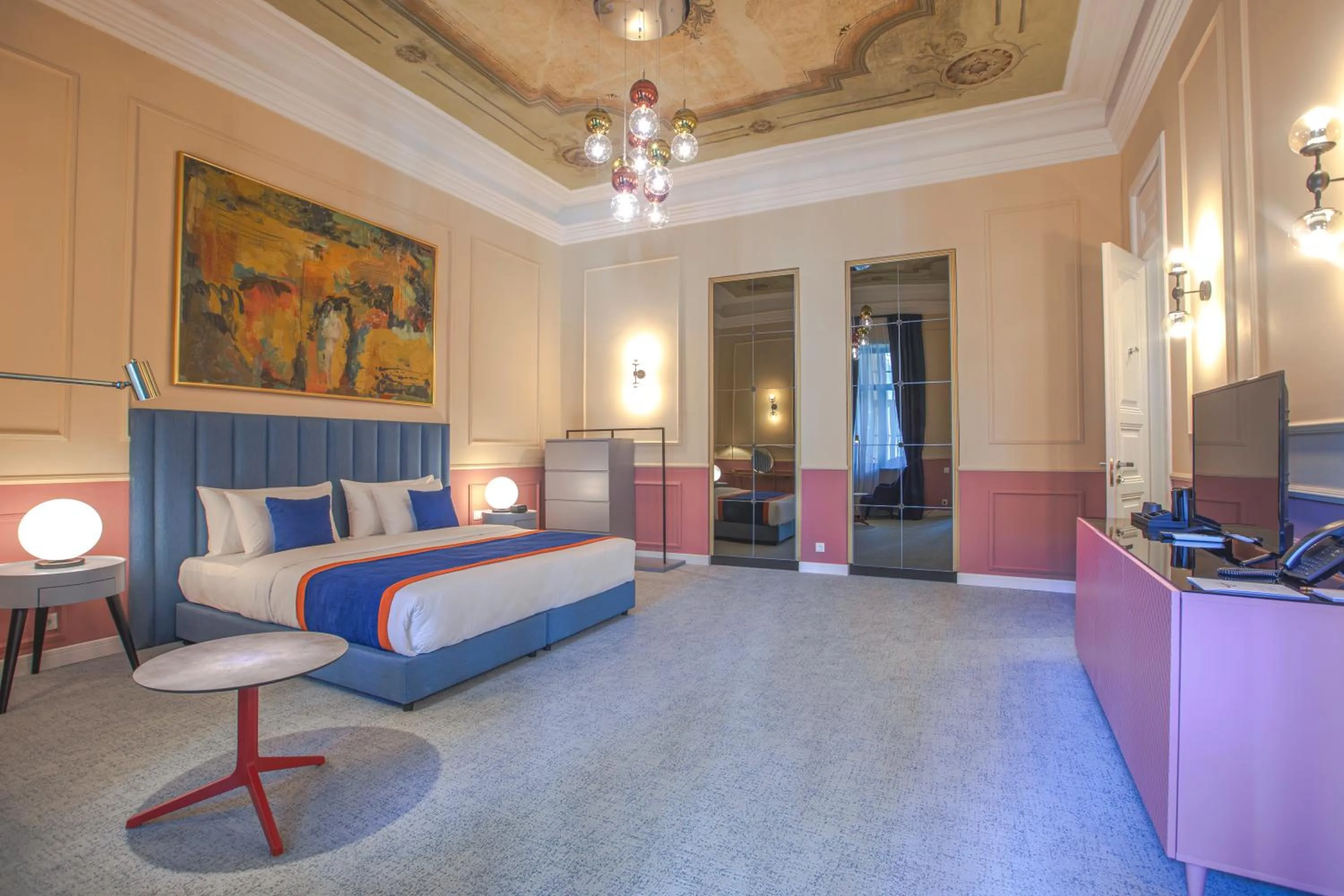 Bed in Heritage Hotel and Suites