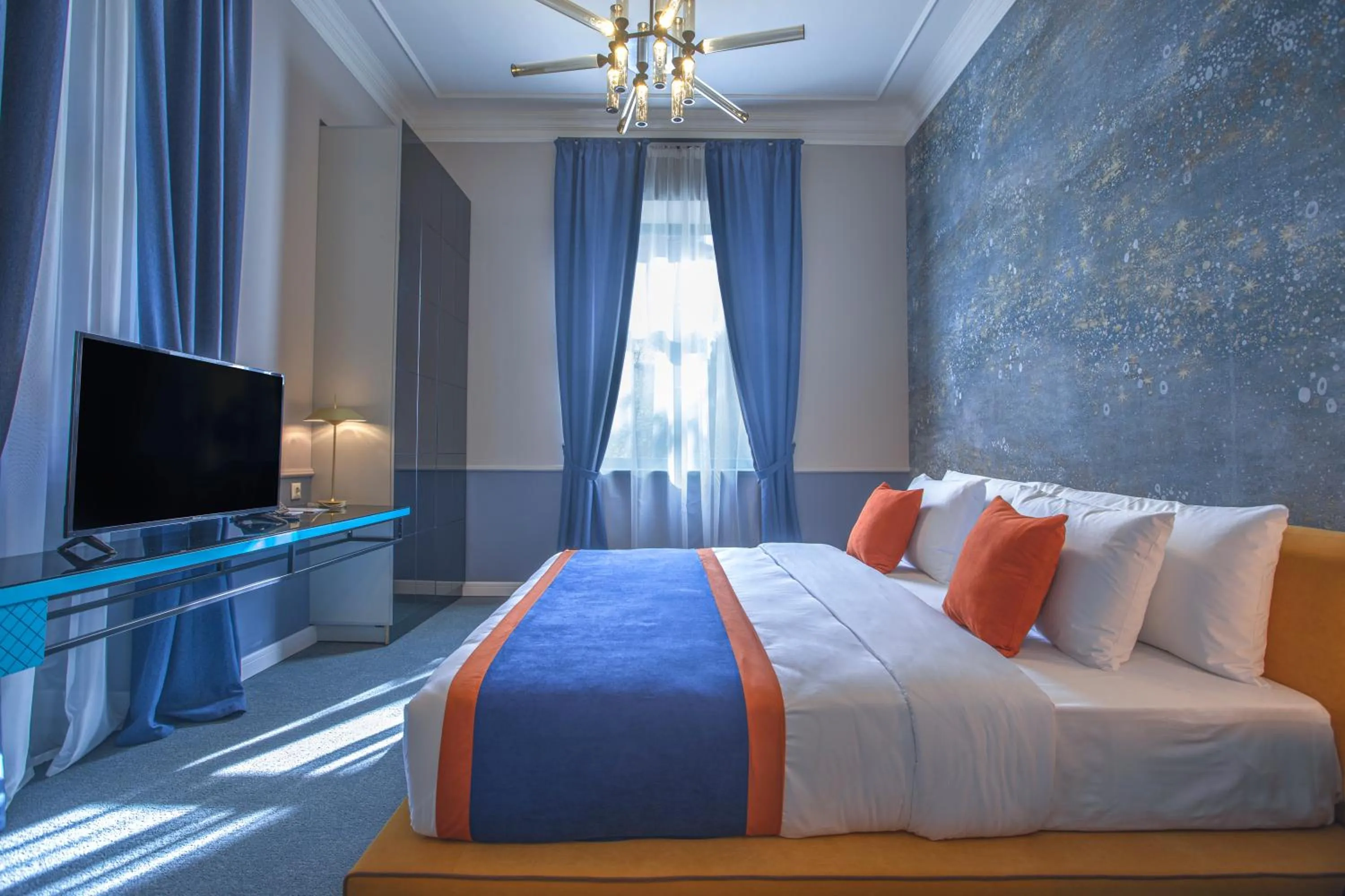 Bed in Heritage Hotel and Suites