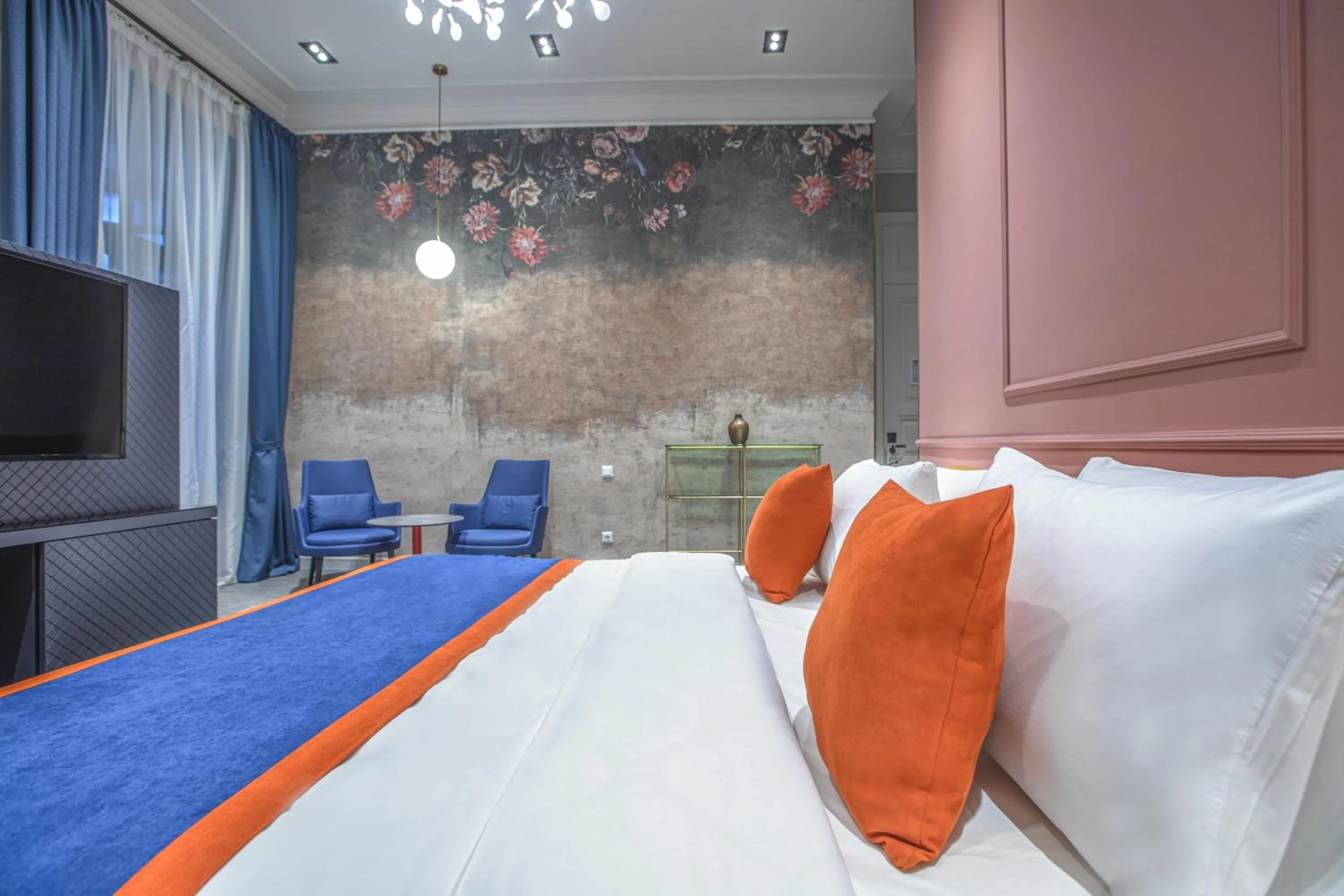 Bed in Heritage Hotel and Suites