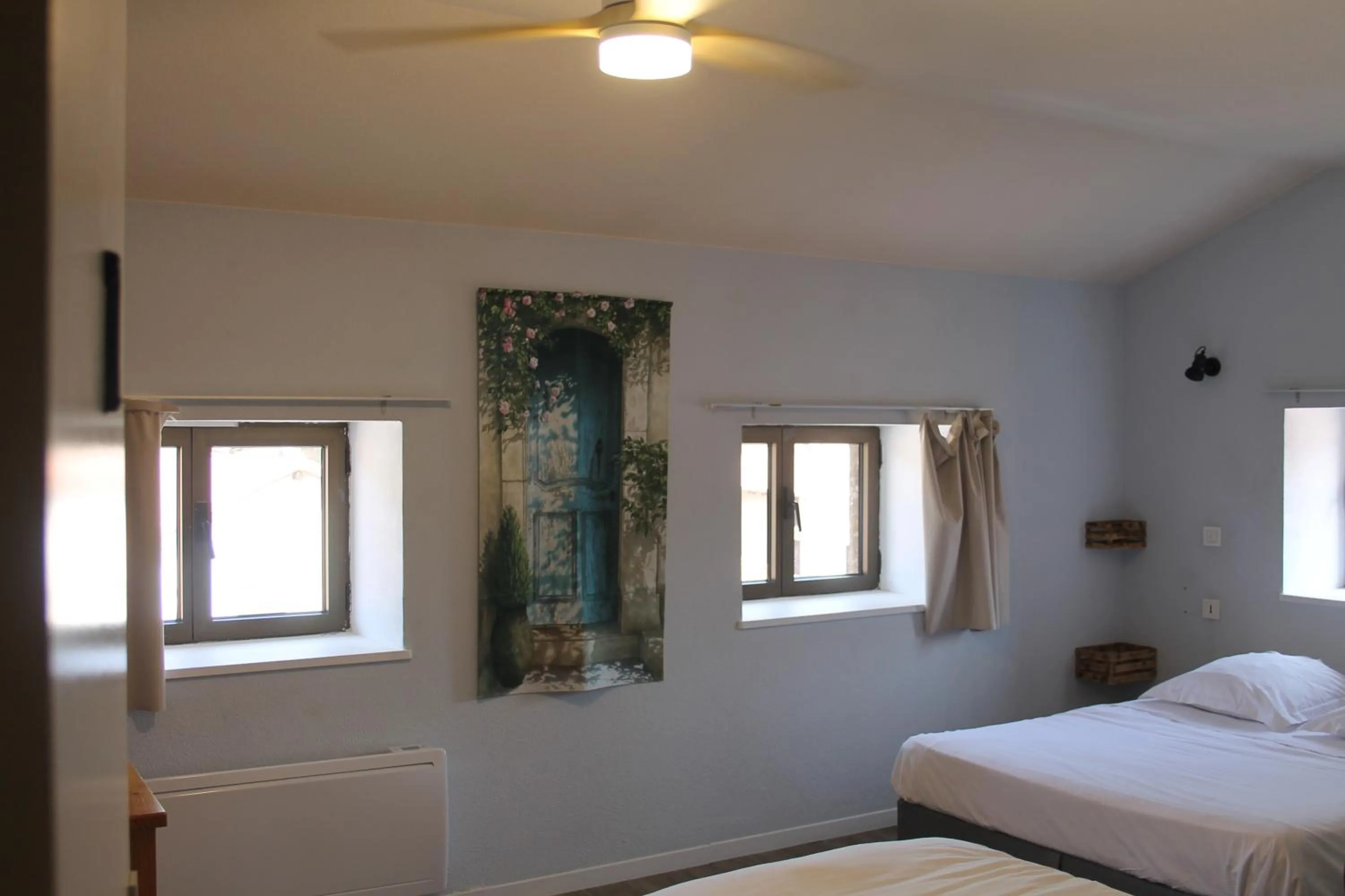 Bed in Logis Hôtel Le Saint Clément