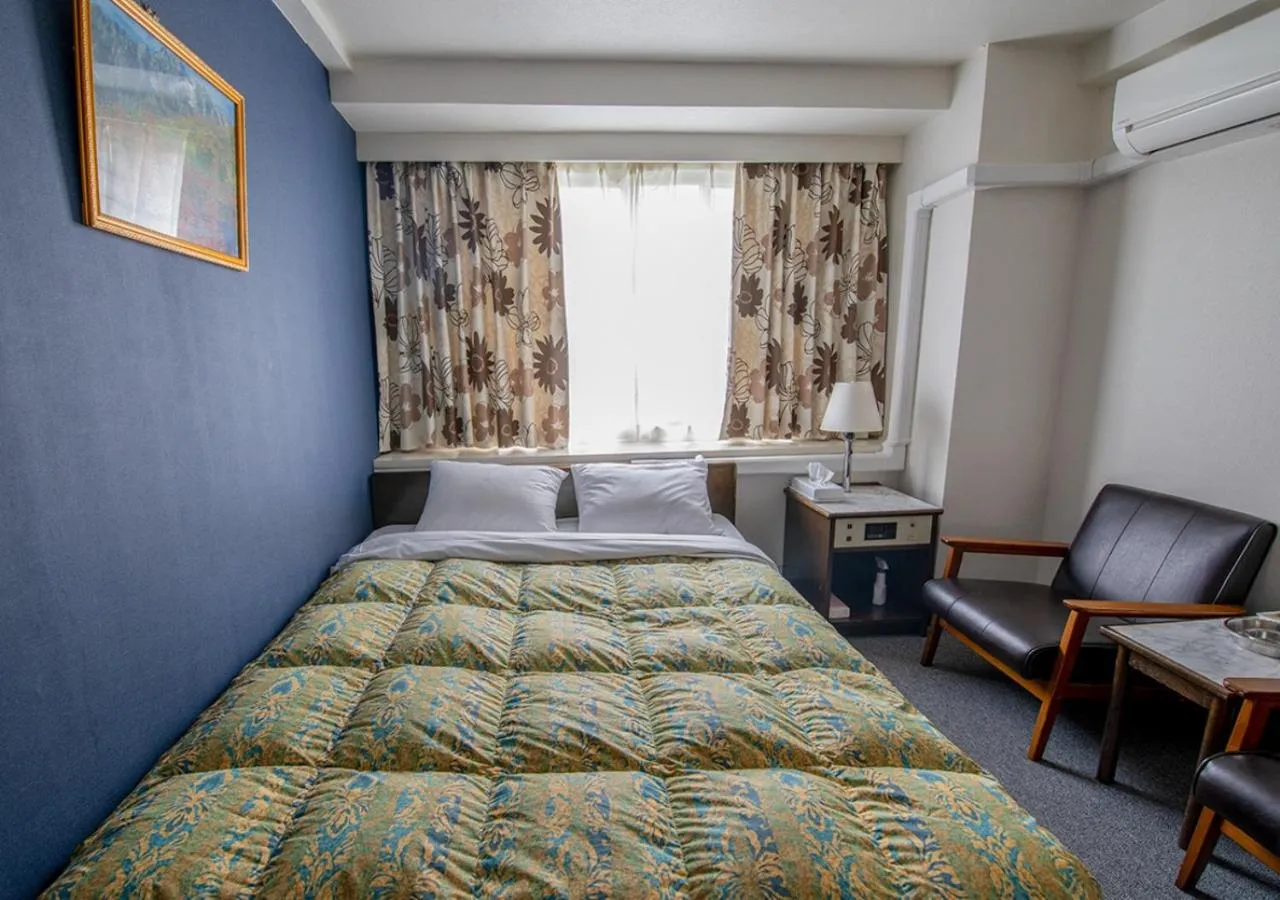 Bed in Hotel Koryukaku